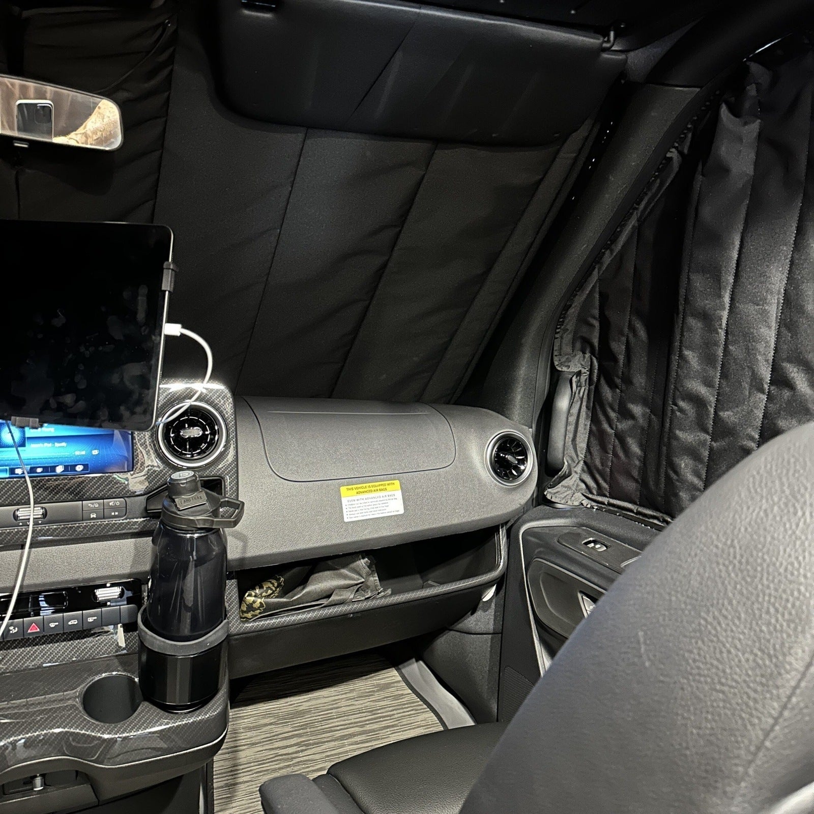 Canyon Adventure Vans CLIMA-SHADE insulated front windshield cover on a vehicle, providing sun and cold protection for the windshield.