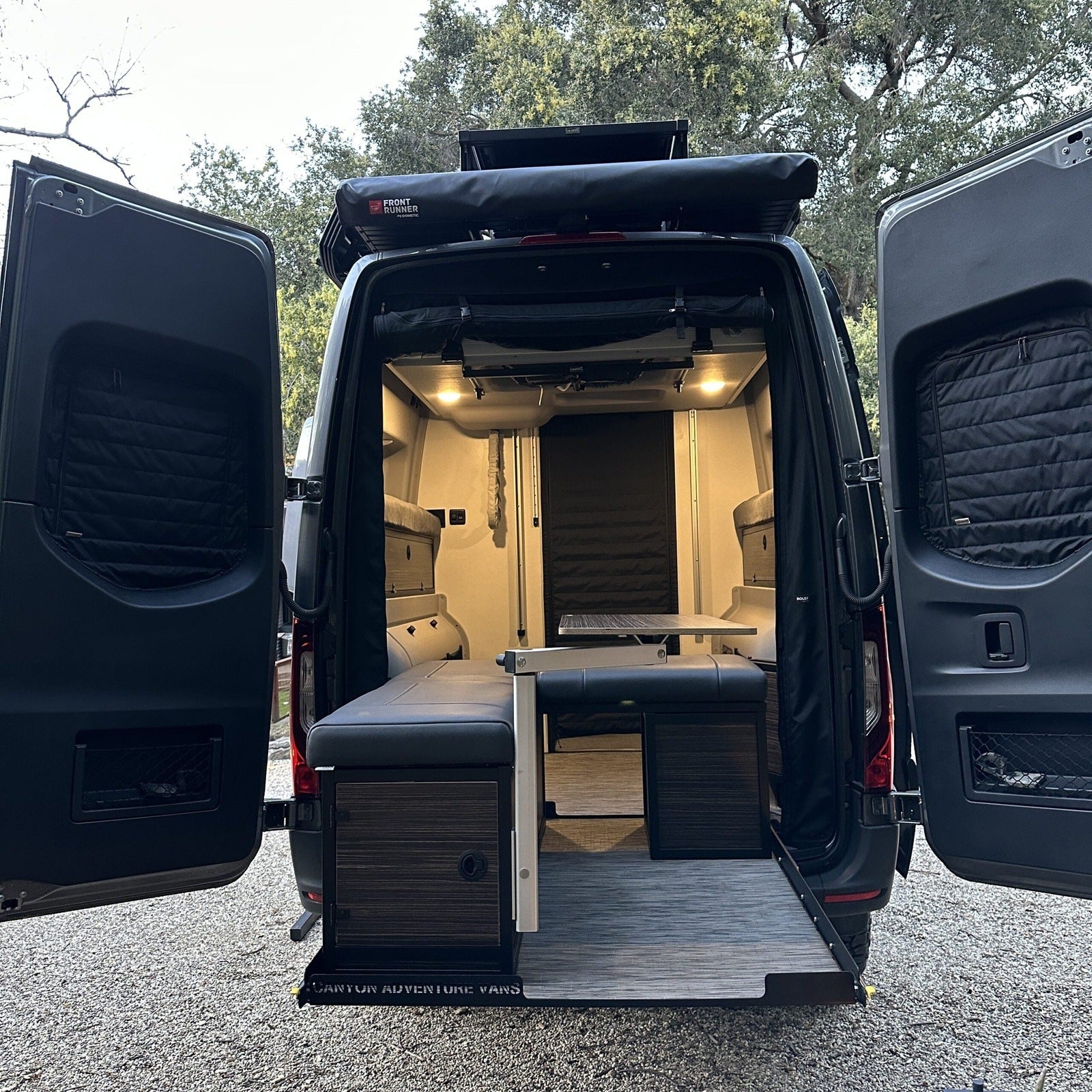 Canyon Adventure Vans CLIMA-SHADE™ insulated rear window covers set for enhanced thermal protection and privacy.