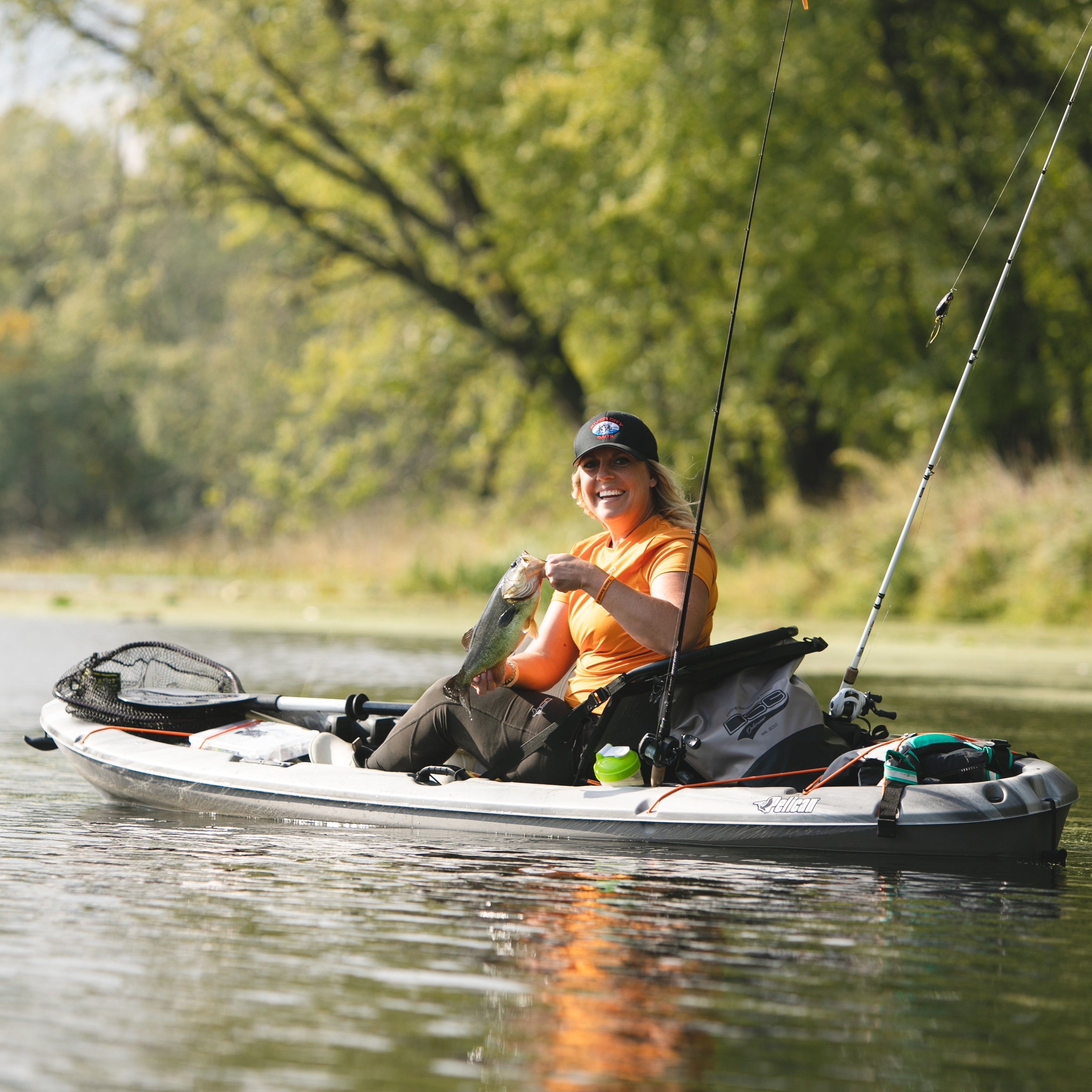 Blue fitted short sleeve shirt with UPF 50+ protection from DSG Outerwear, shown on a hanger.