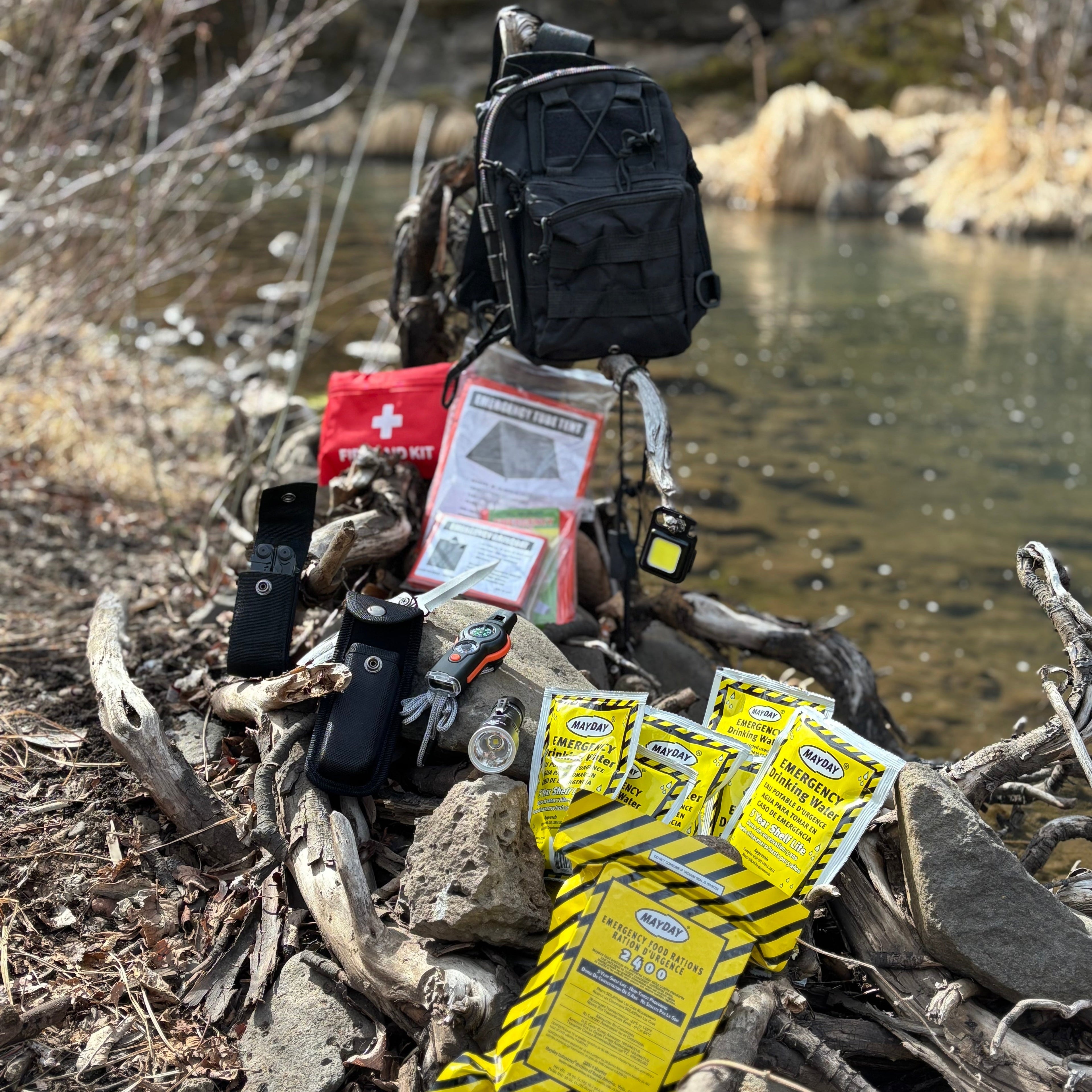 Entropy Survival Safe Trail Survive All Go Bag emergency preparedness kit with multiple compartments and survival gear.