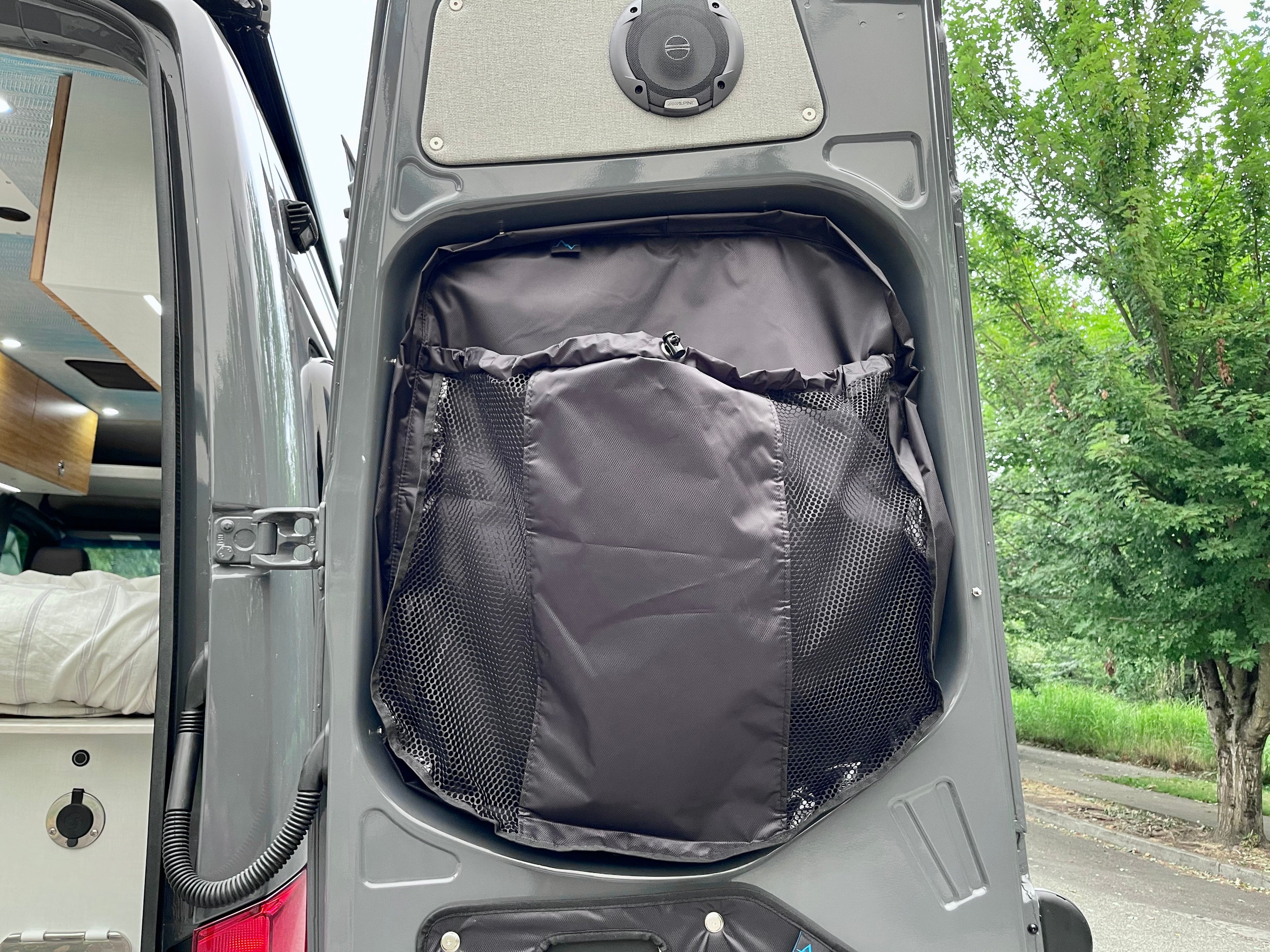 Alpine Van Works AVW Mid-Door Bags in storage solutions, showing durable fabric bags installed inside a vehicle door for organization.