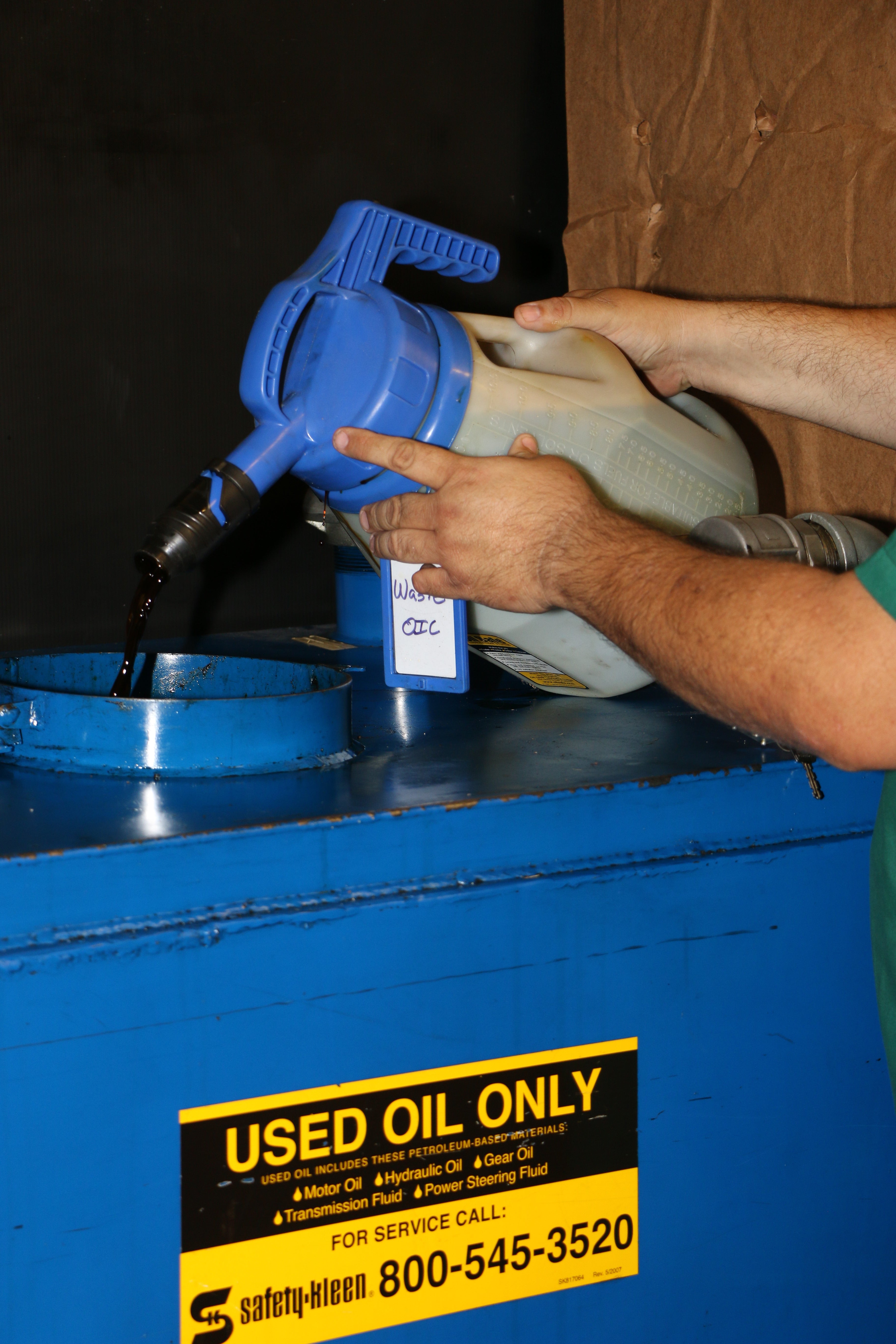 OilSafe Stretch Spout controlled-flow oil transfer lid on a DRIVEN Racing Shop transfer container for precise oil pouring.