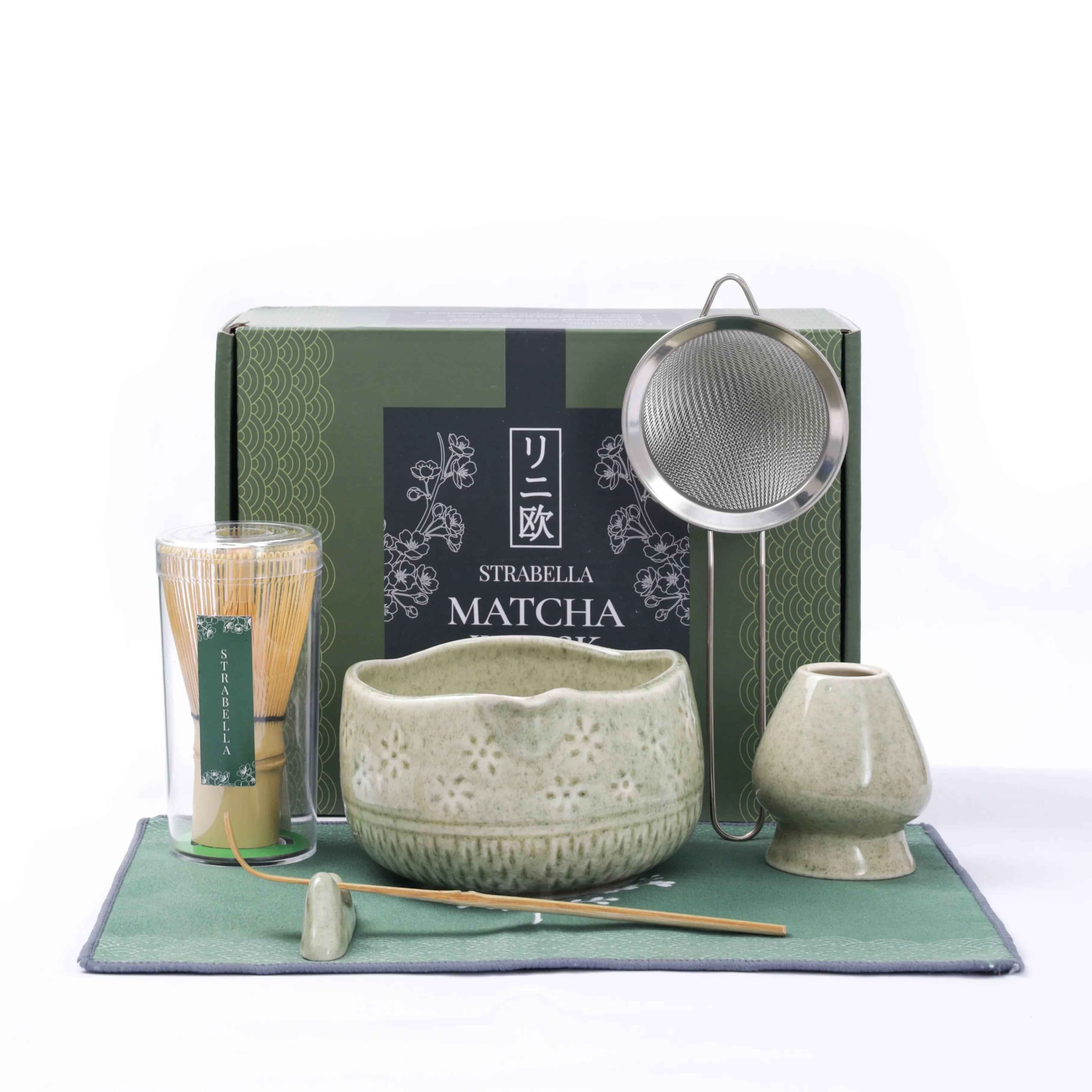 Strabella-Home Matcha whisk set with bamboo whisk and ceramic bowl for traditional tea preparation, displayed on a wooden surface.