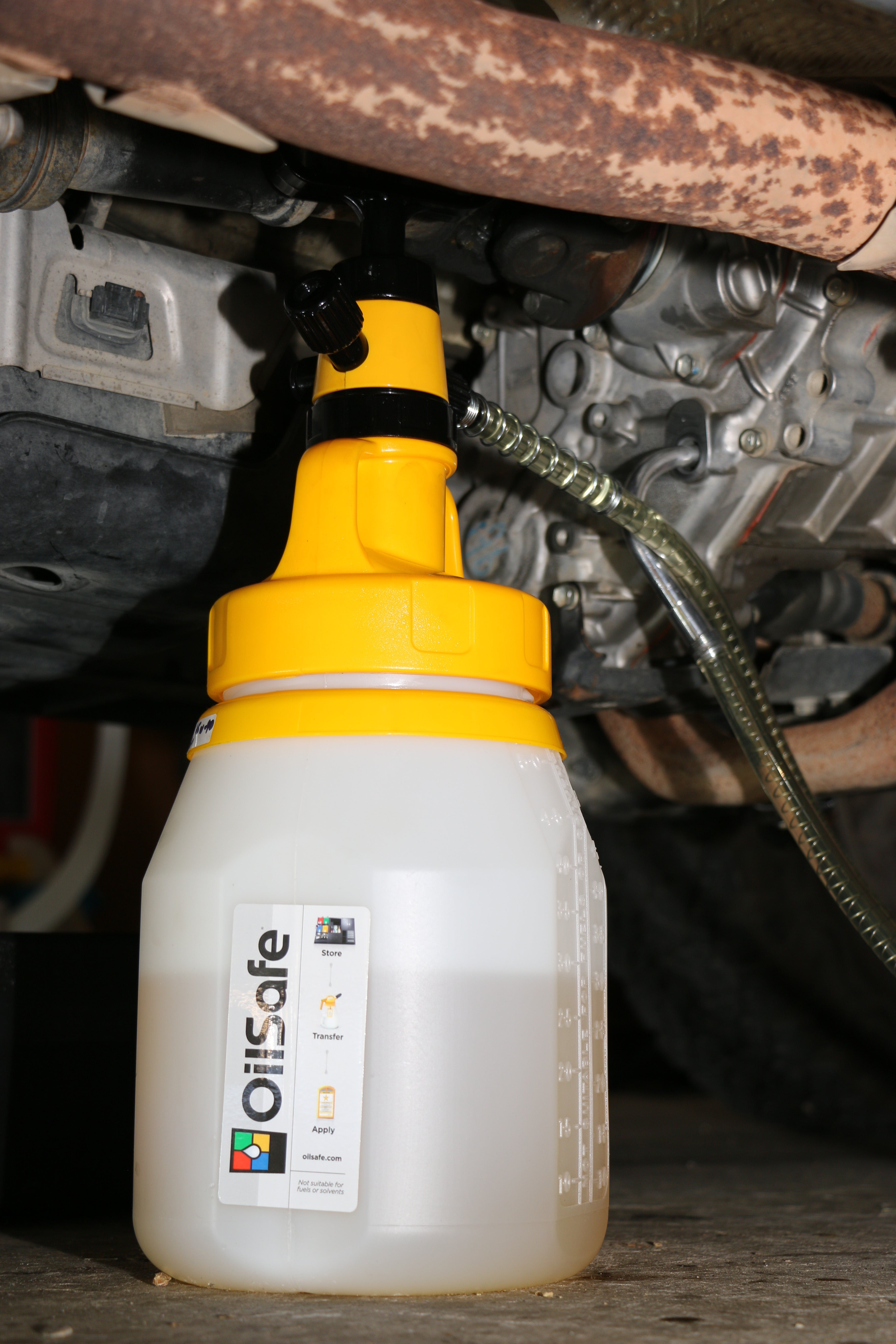 OilSafe Utility Lid for Oil and Fluid Transfer Container by DRIVEN Racing Shop, shown on a transfer container with secure seal