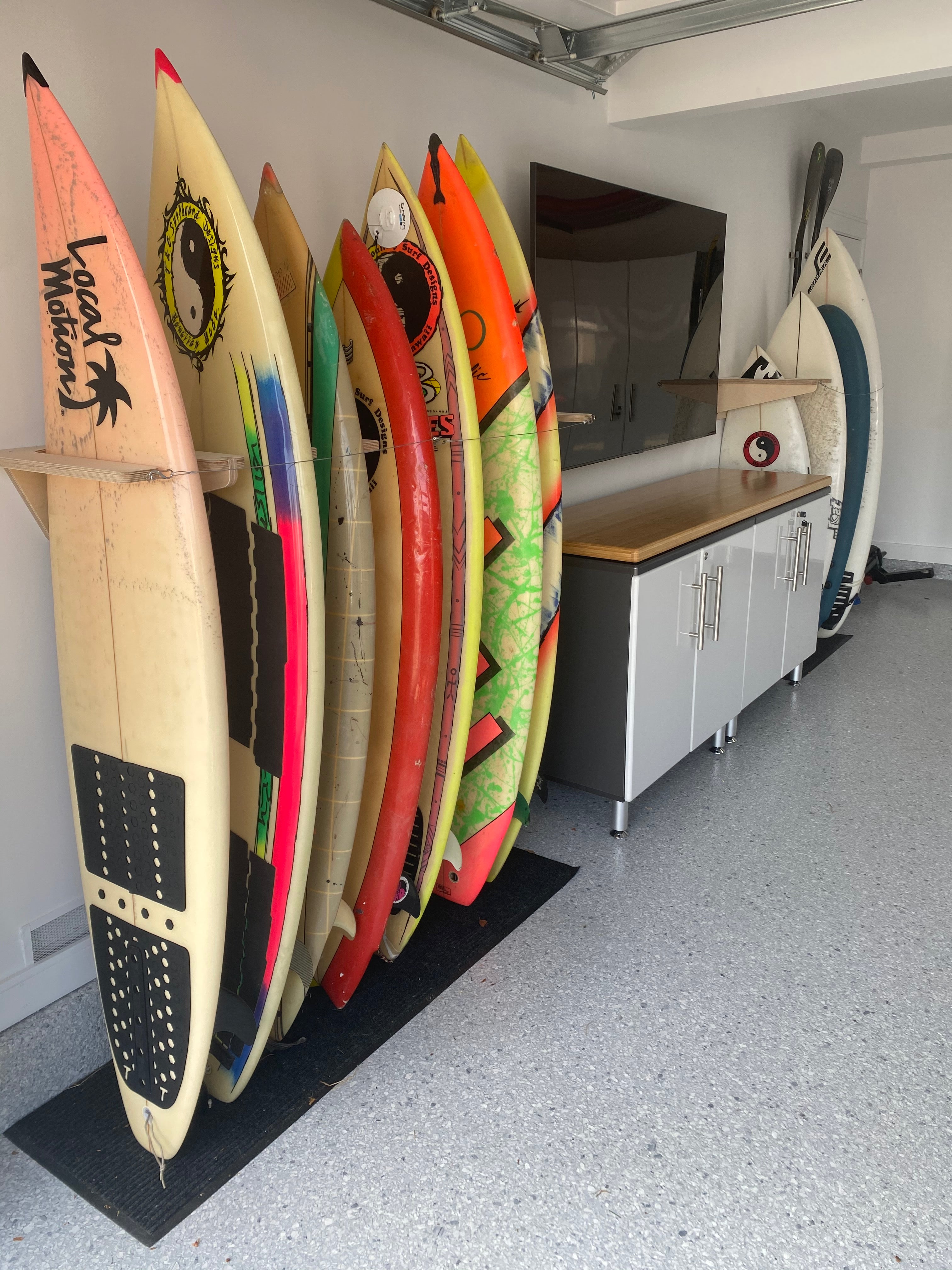 Rado Racks Freestyle surfboard wall rack holding a surfboard on a wall for easy storage and display.