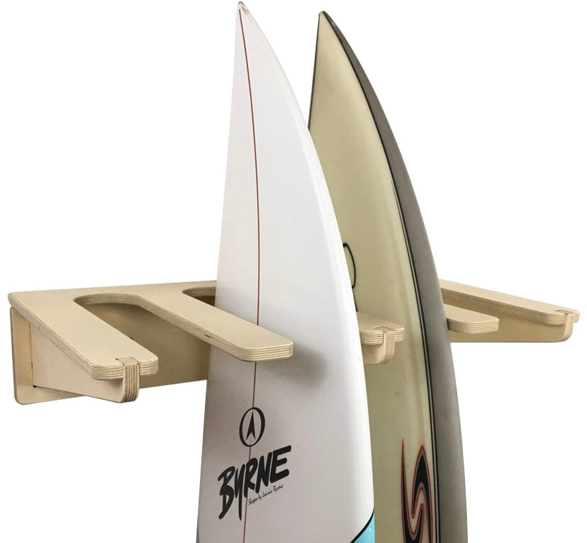 Rado Racks Freestyle surfboard wall rack holding a surfboard on a wall, made of sturdy material for secure storage.