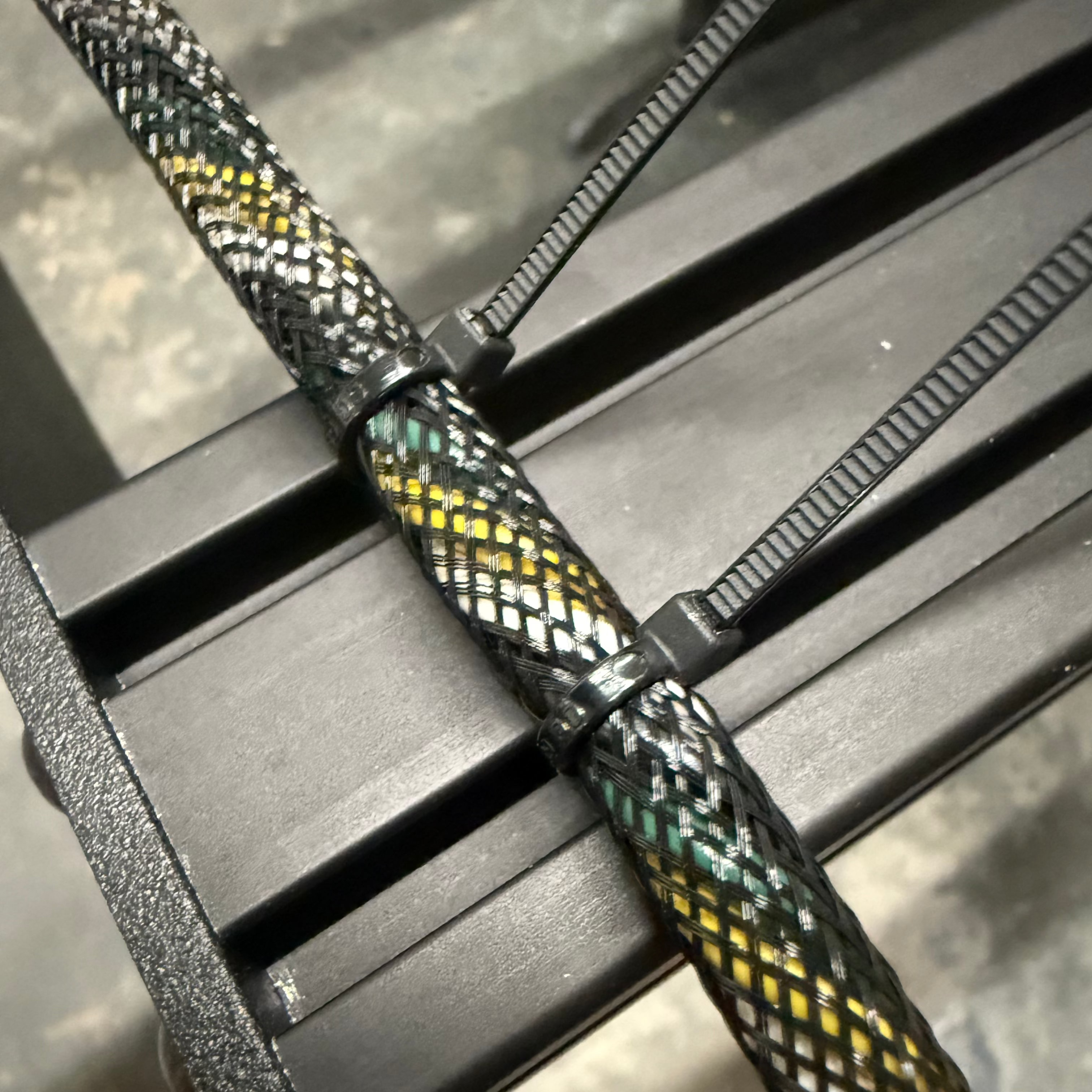 Aspire Auto Accessories wire management zip-tie holders for roof racks, designed to organize and secure cables efficiently.