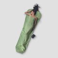 COCOON Insect Shield® MummyLiner™ Silk in a folded position, showcasing its lightweight fabric and protective design.