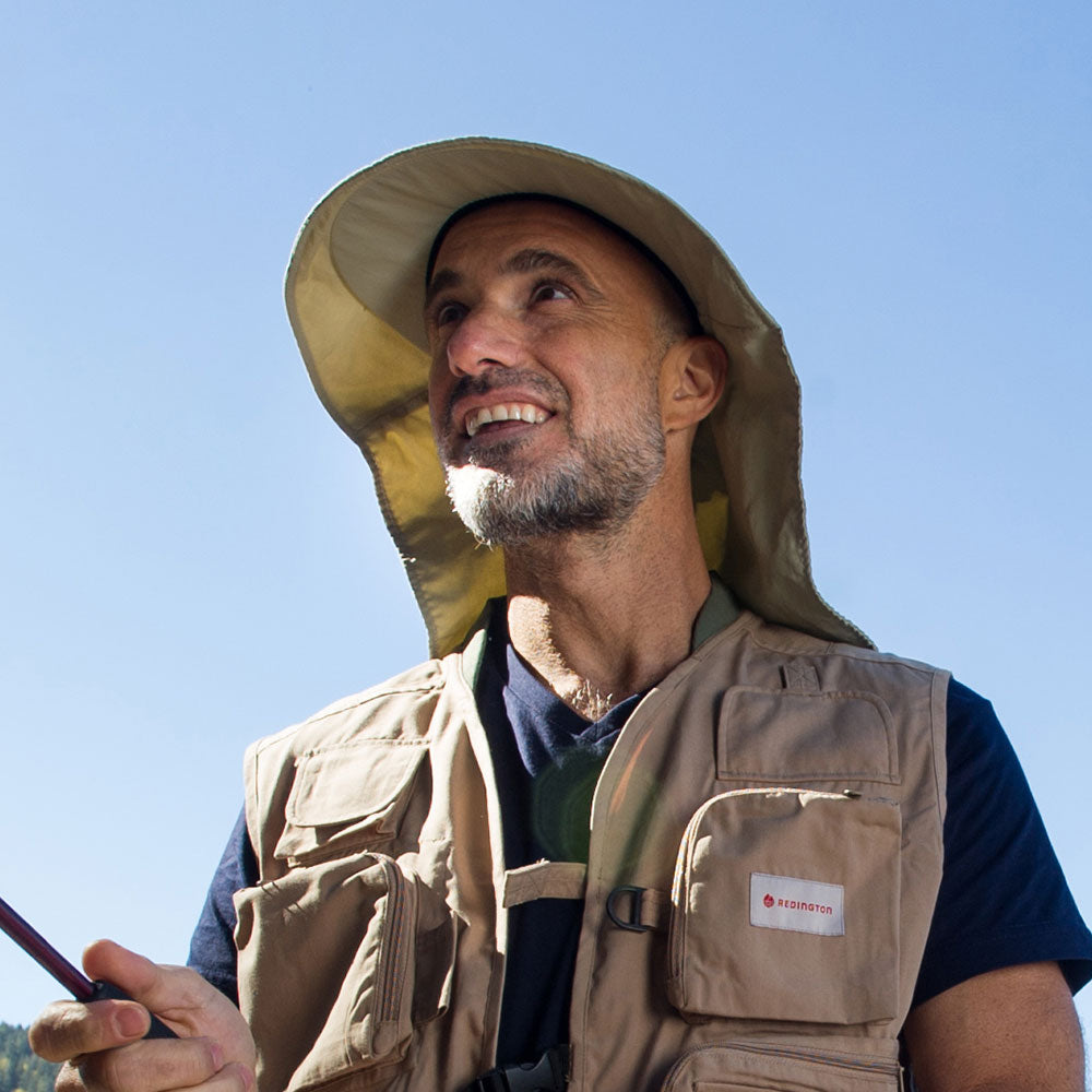 Juniper Outdoor Nature Hat in neutral color, featuring wide brim and adjustable strap for outdoor protection and style.