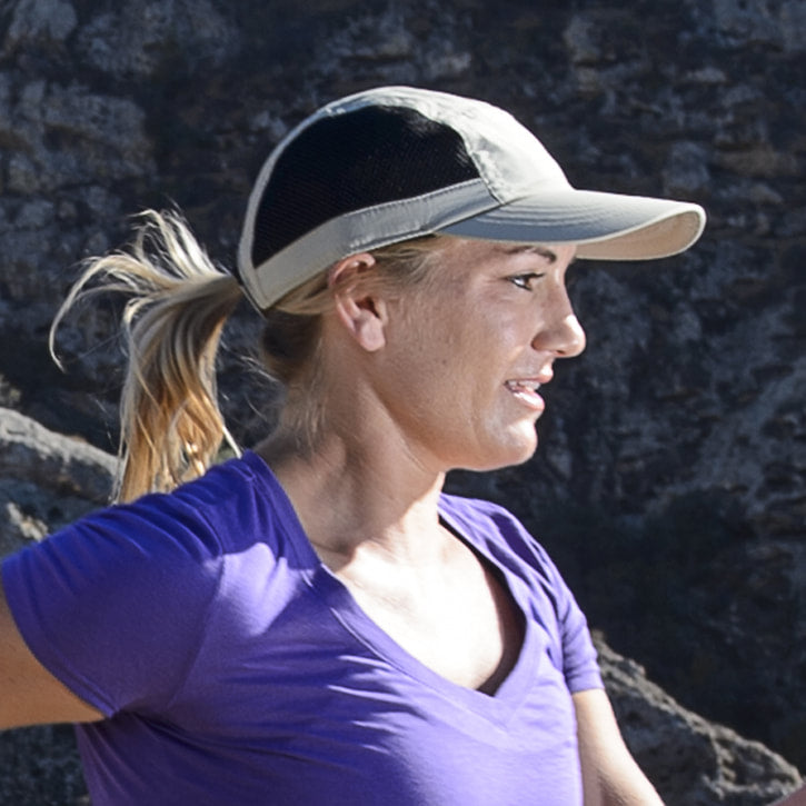 Juniper Outdoor jogger cap in black, made of breathable fabric with a curved brim and adjustable strap for a comfortable fit.