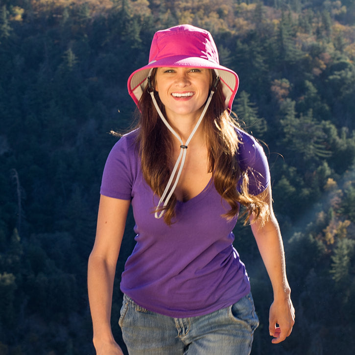 Juniper Outdoor Lily Sun Hat in natural fabric with wide brim for sun protection, shown on a mannequin.
