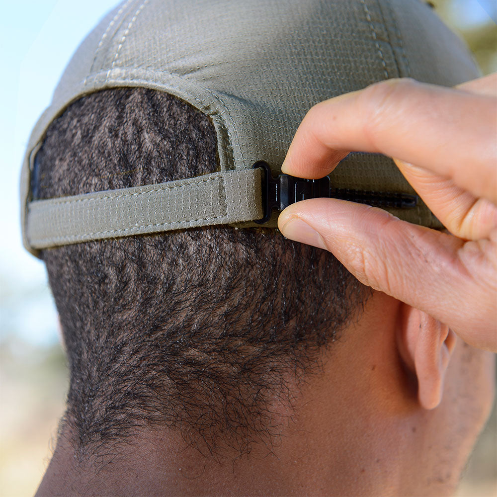 Juniper Outdoor Flex Brim physical product with flexible brim and durable fabric, shown on model in outdoor setting.