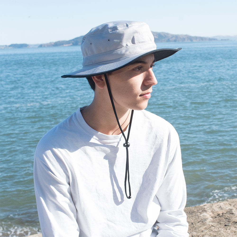 Juniper Outdoor Pro Performance Bucket Hat shown in a neutral color, designed for outdoor activities and sun protection.