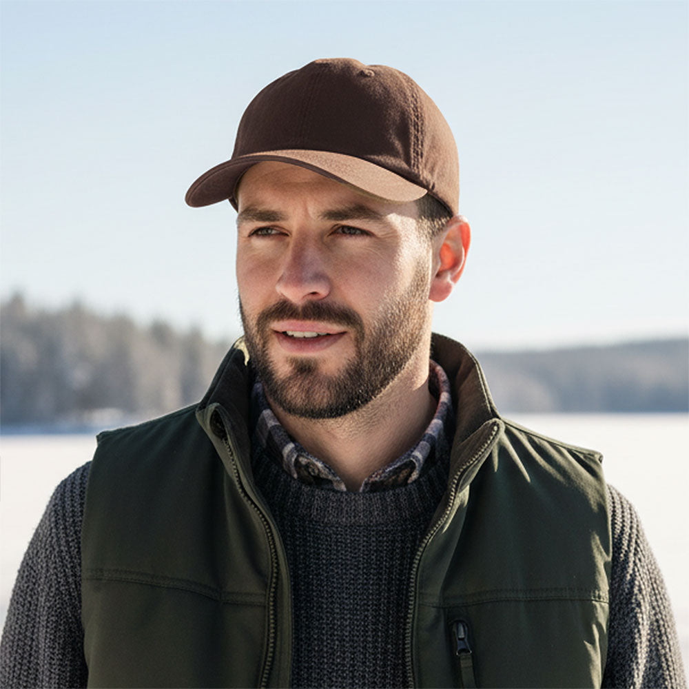 Juniper Outdoor Billy Wax Cap, a stylish physical cap in waxed fabric with adjustable strap and classic outdoor design.