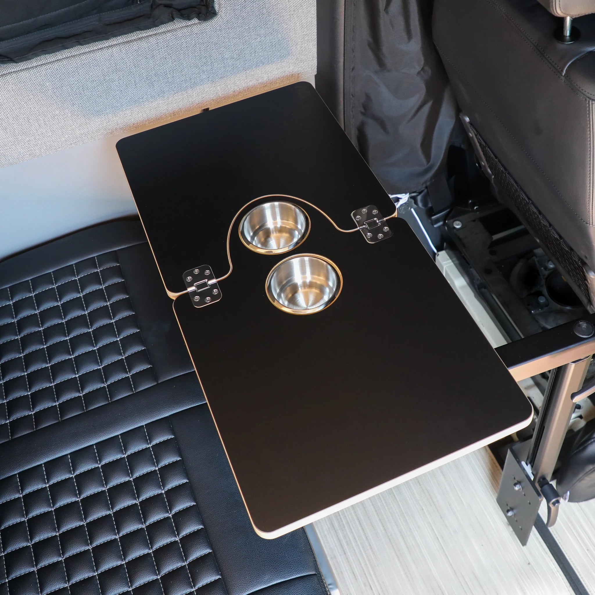 Canyon Adventure Vans Jenna 2.0 folding table top in carbon finish, showcasing its compact, portable design for versatile use.