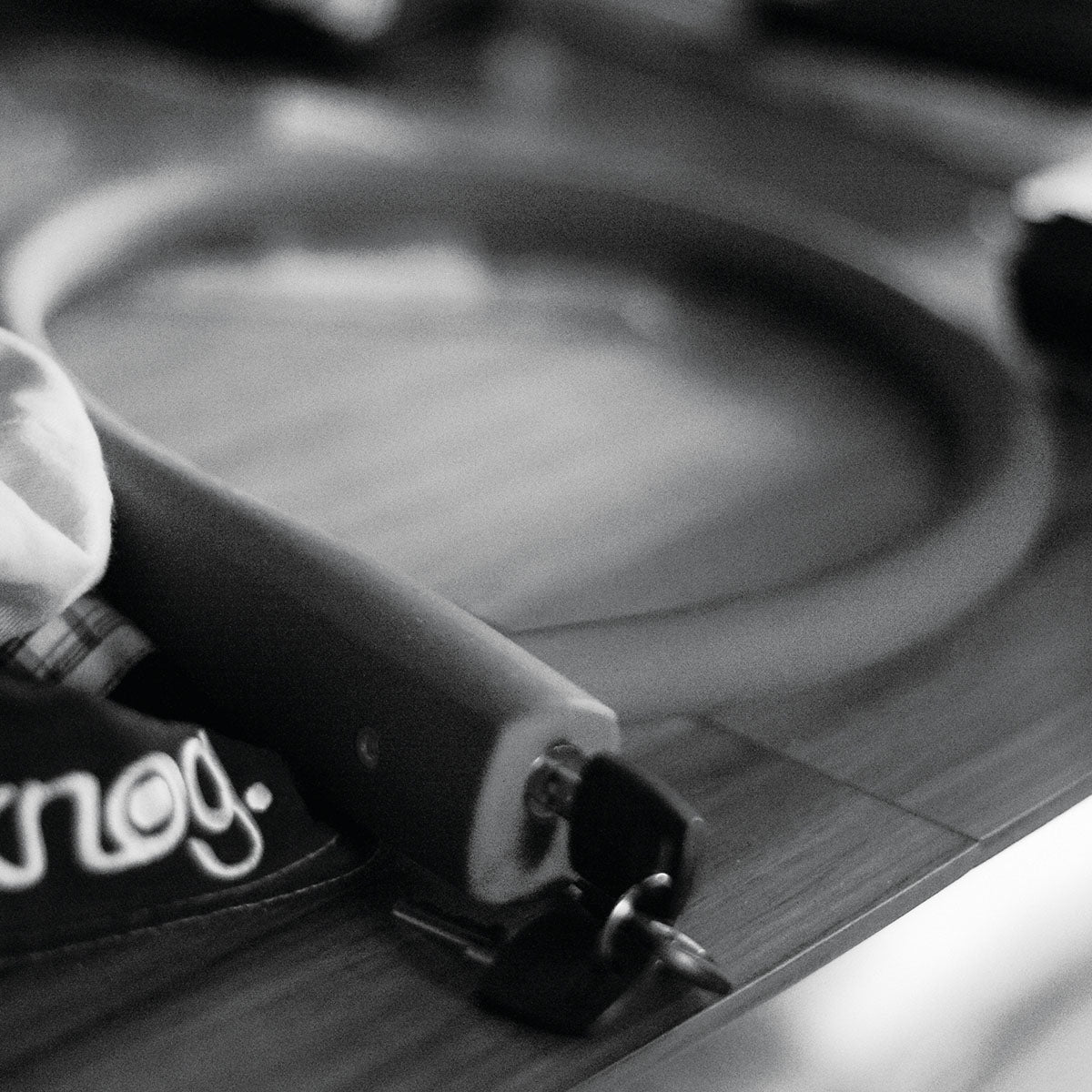 Knog Kabana cable lock by ZEITBIKE with braided steel cable and key lock mechanism, shown coiled for security and portability.