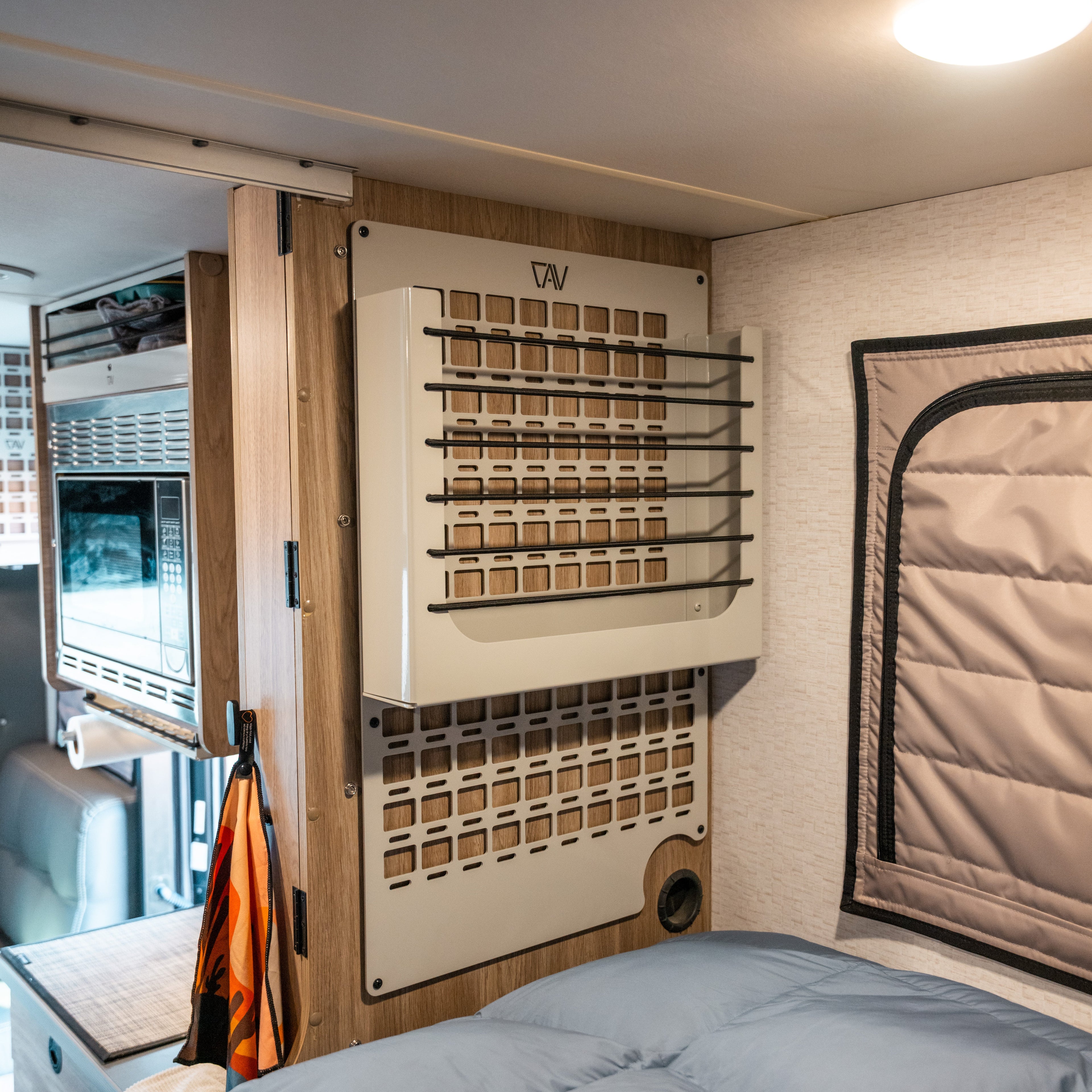 Ekko MOLLE Shelf System by Canyon Adventure Vans, made in Utah, featuring durable mounting with MOLLE webbing for versatile storage.