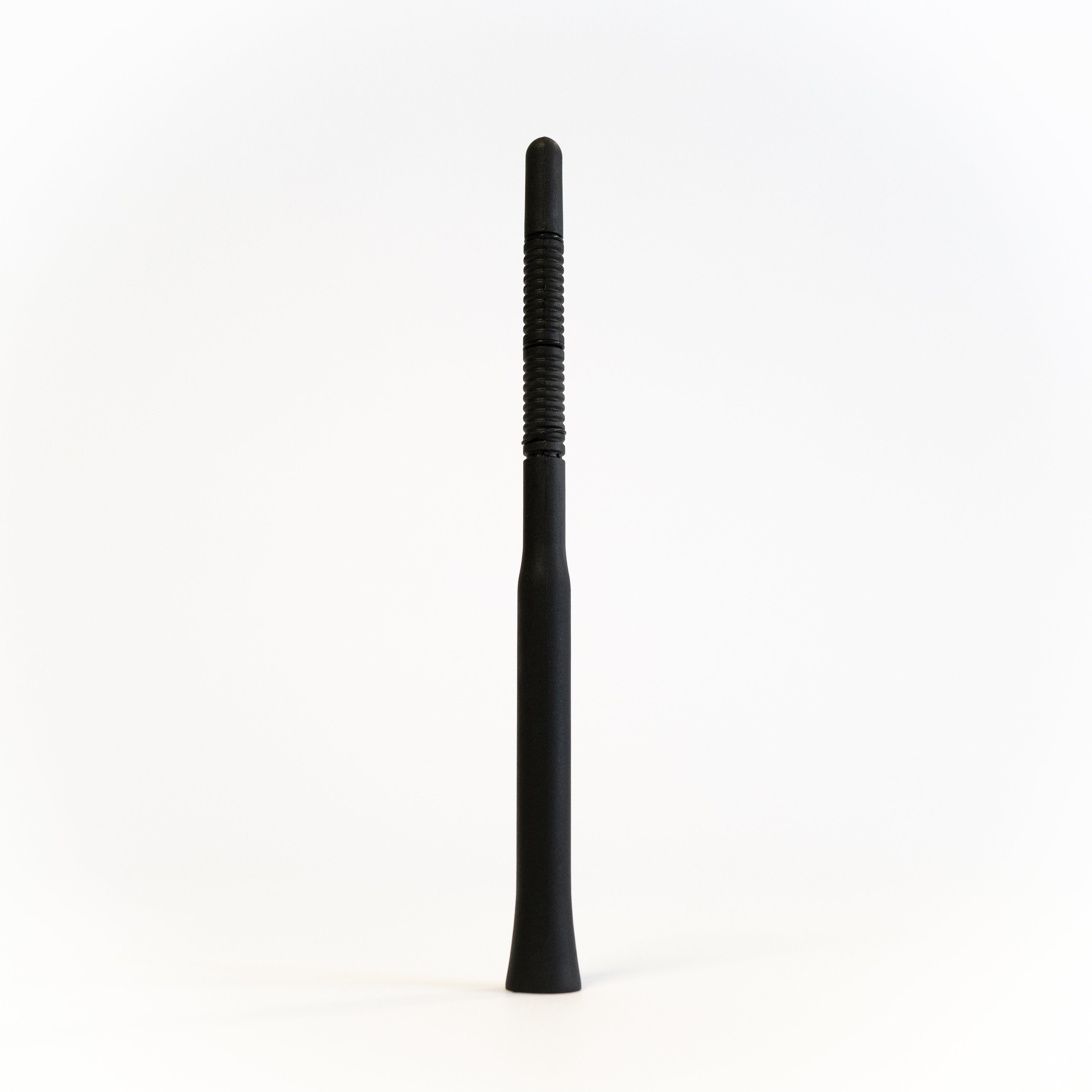 Sprinter short antenna by The Van Mart, compact radio antenna with black finish, mounted on a vehicle's rooftop.