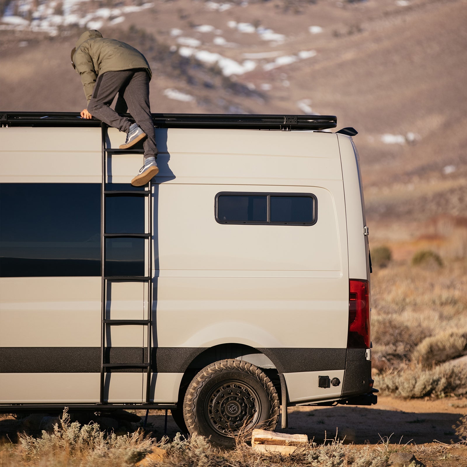 Vanspeed Sprinter side ladder for van exterior, sturdy metal construction with rungs for easy access to roof.