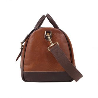 Backcountry Sportsman Bison Leather Sportsmans Duffel bag seen from the side with sturdy leather and natural brown finish.