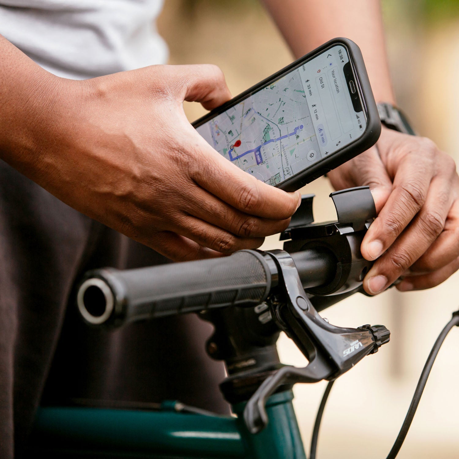 ZEITBIKE Loop Mount universal bicycle phone mount with phone secured in place on bike handlebar.