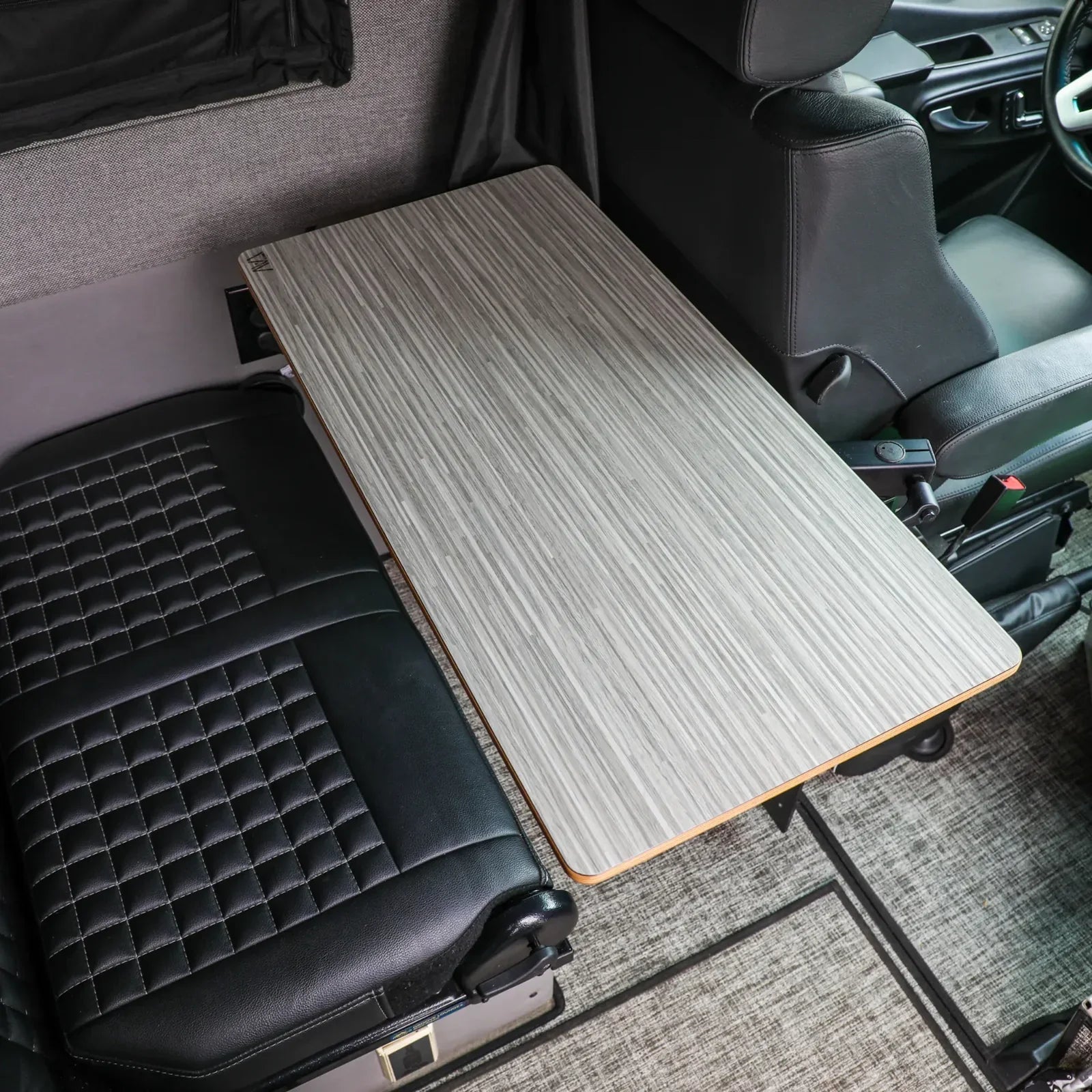 Large universal table top in silver oak finish by Canyon Adventure Vans, displaying a smooth surface and sturdy design.