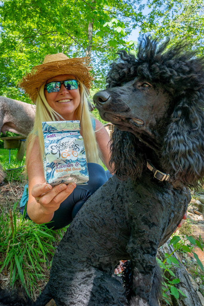 Lavender and arnica bath salts in a jar, relaxing tub salt blend by Essential Journeys for soothing bath experiences.