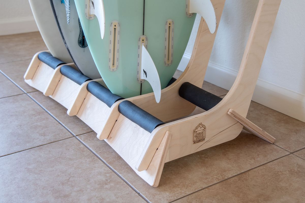 Freestanding surfboard rack by Rado Racks, showcasing multiple surfboards in a sleek, sturdy design.