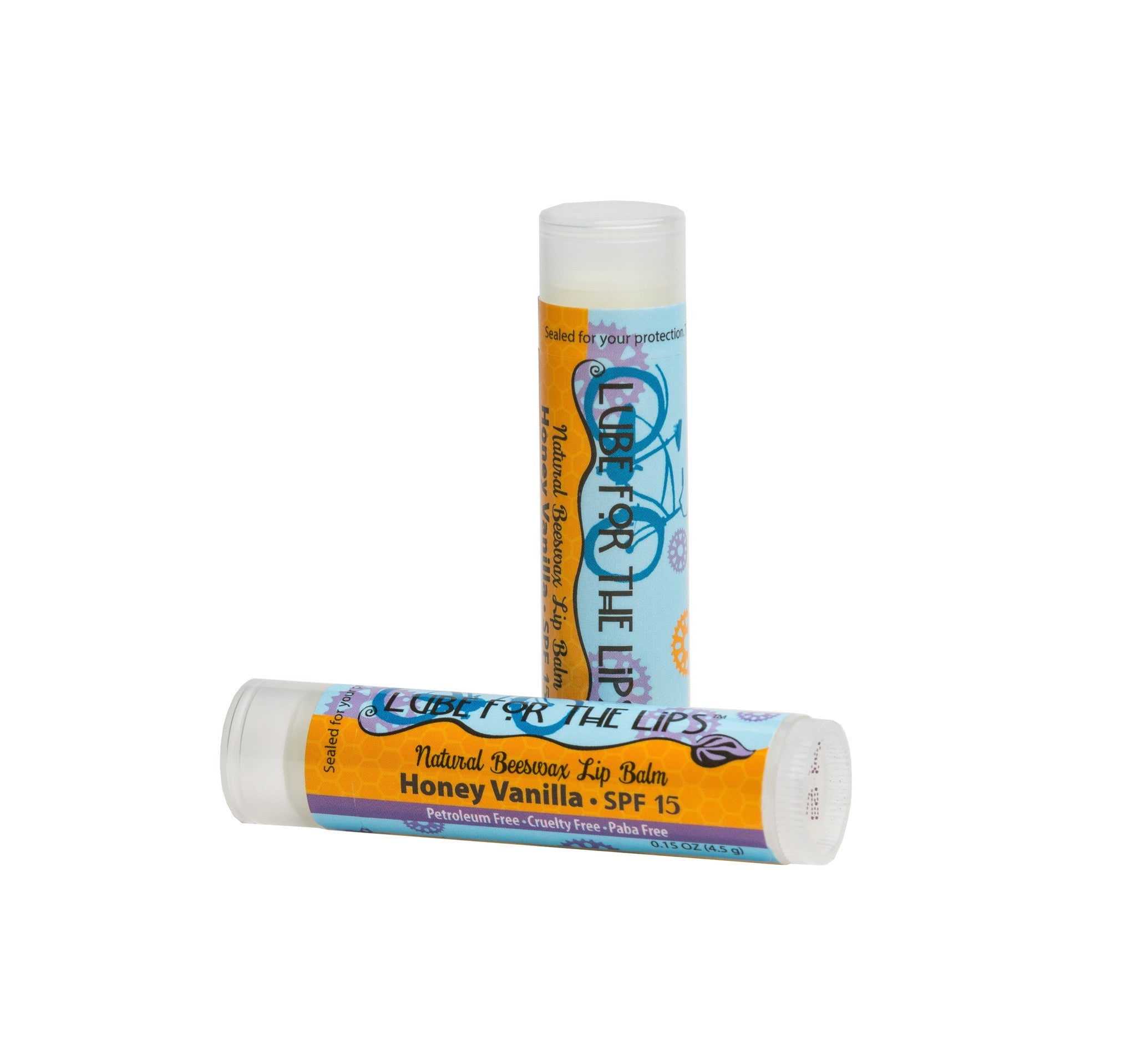 Essential Journeys Honey Vanilla SPF 15 lip balm, a moisturizing lip lube with vanilla scent and sun protection.