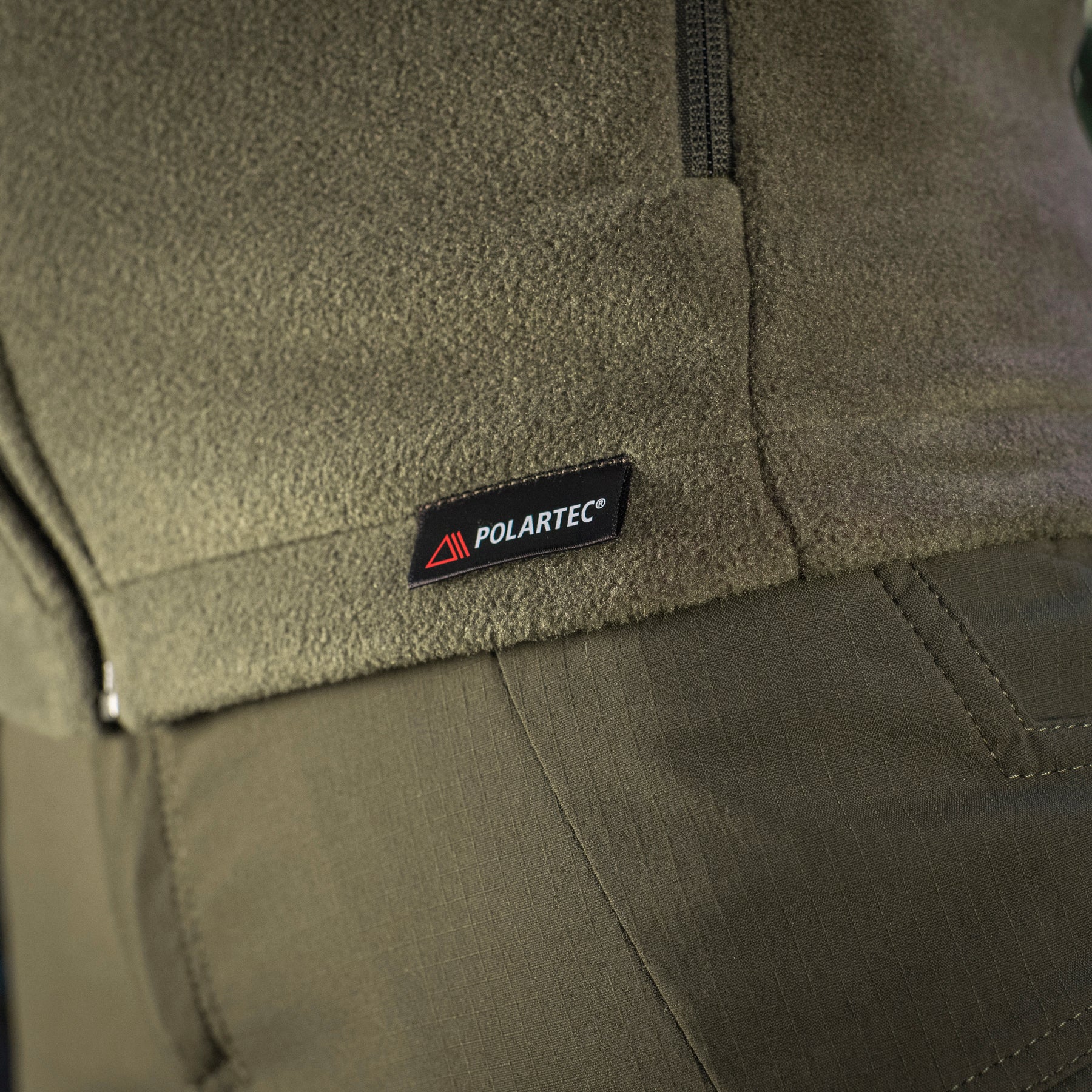 M-TAC Nord Polartec fleece jacket in olive green, featuring a zip closure and soft, warm fabric for outdoor activities.