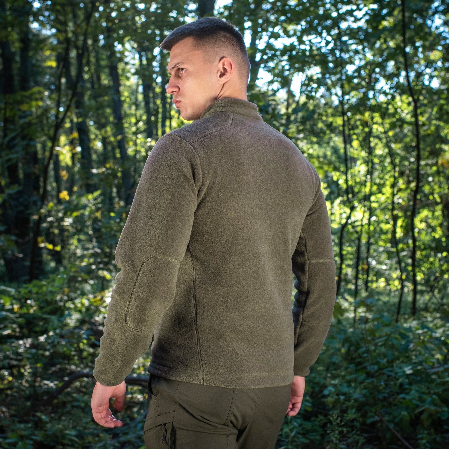 M-TAC Nord Polartec fleece jacket in olive green, showcasing soft fabric and practical design for outdoor activities.