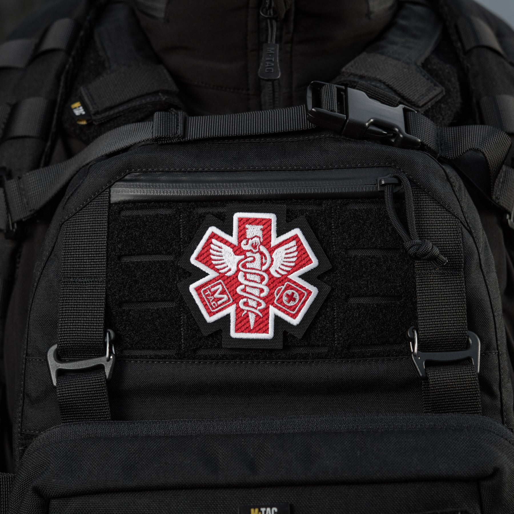 Embroidered M-Tac Paramedic patch in black, showcasing detailed design and vibrant colors for tactical gear.