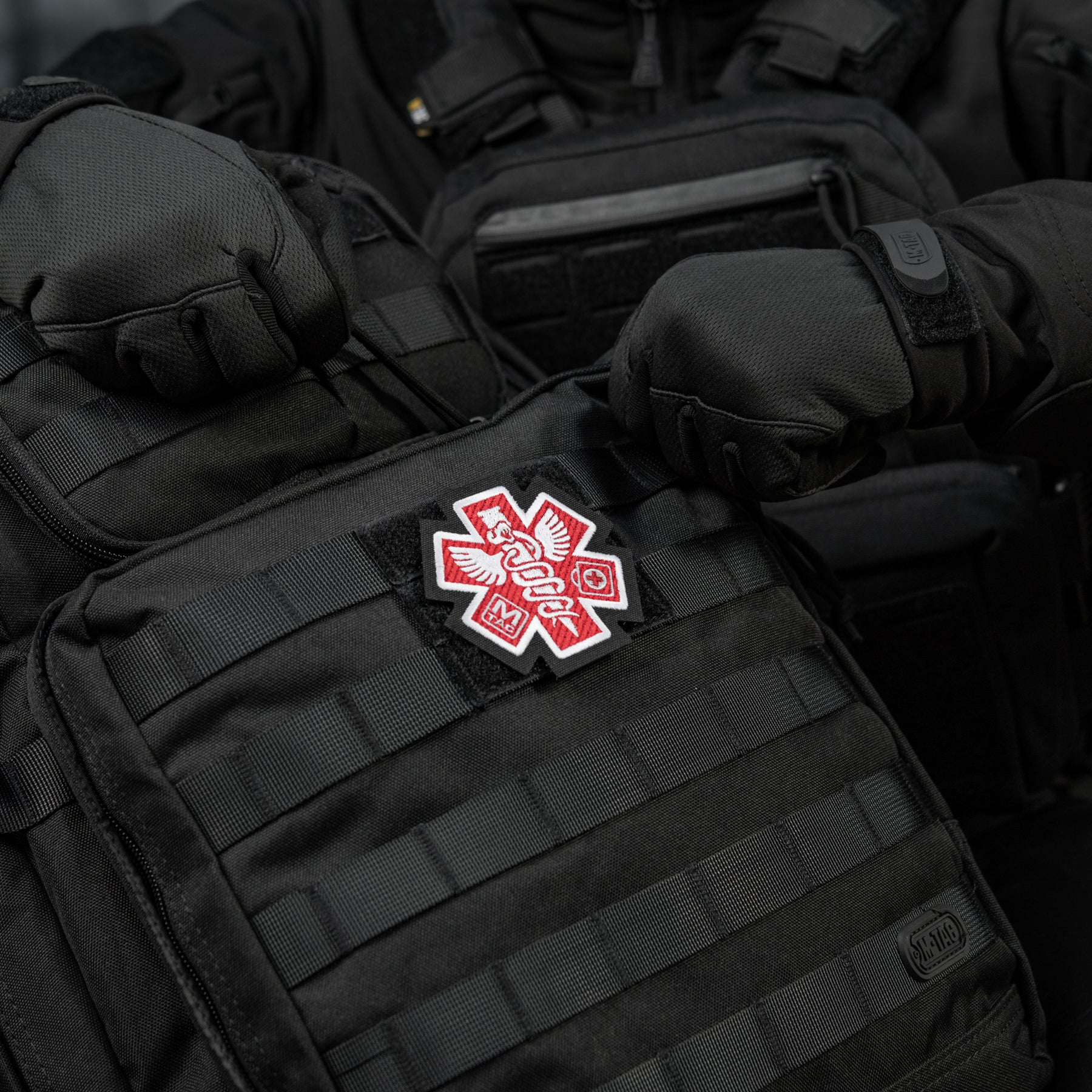 Embroidered M-Tac Paramedic patch on a black background, featuring bold red and white medical cross design.