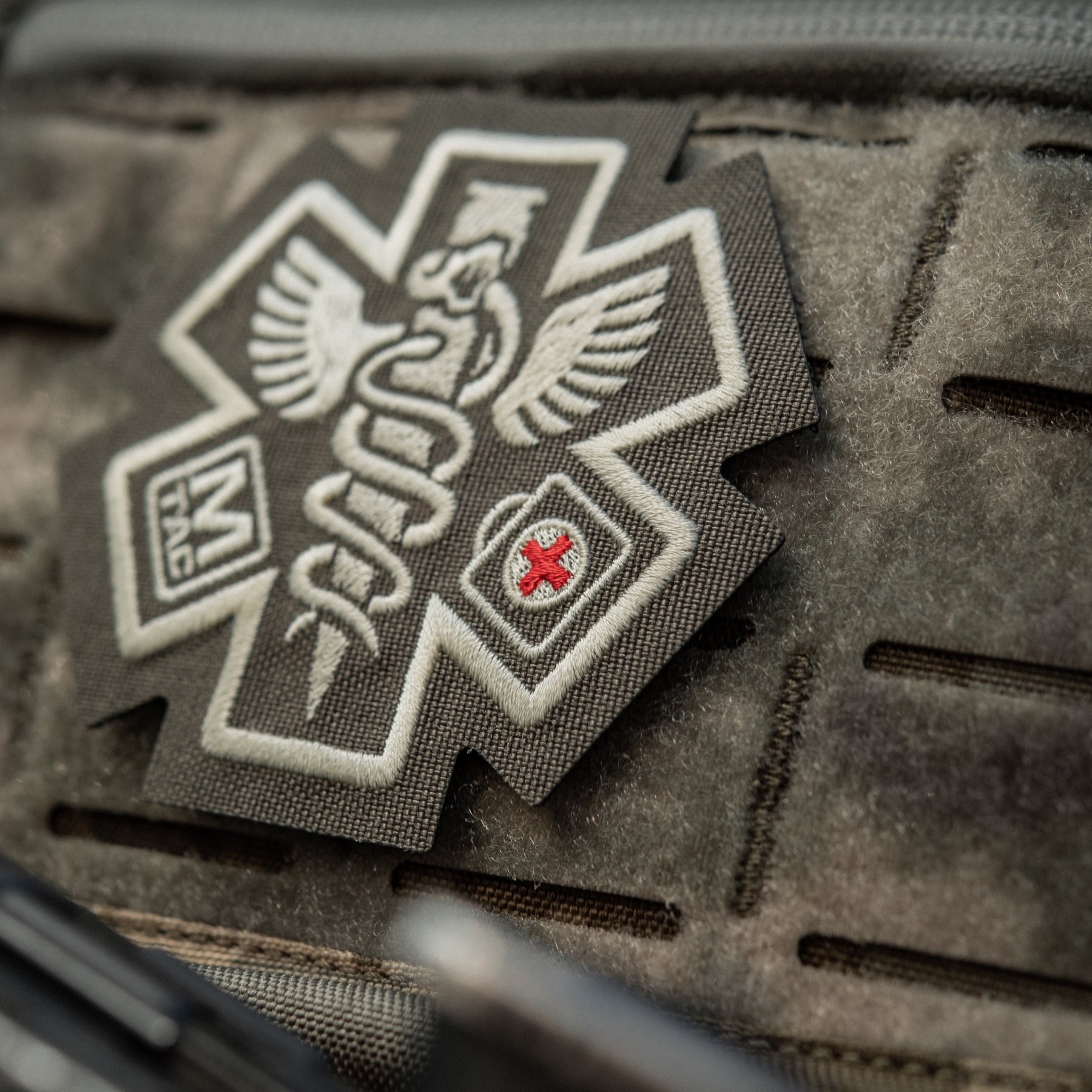 M-Tac Paramedic embroidered patch in ranger green, featuring detailed medical insignia on durable fabric.