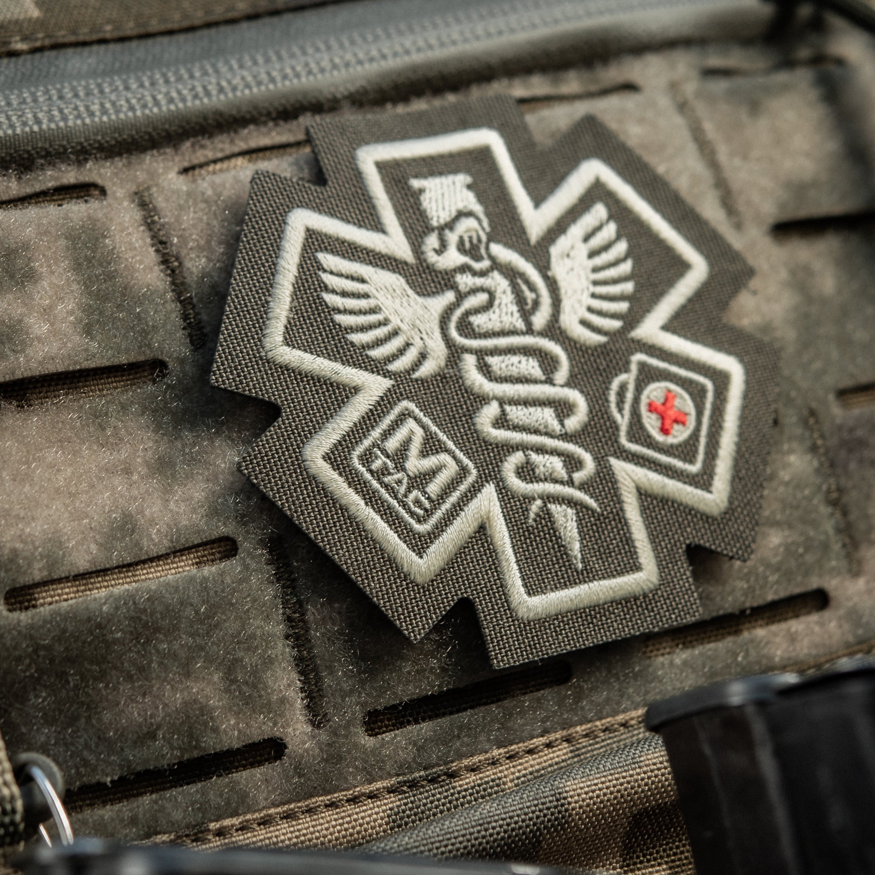M-Tac Paramedic embroidered patch in ranger green, featuring medical symbols on durable fabric.