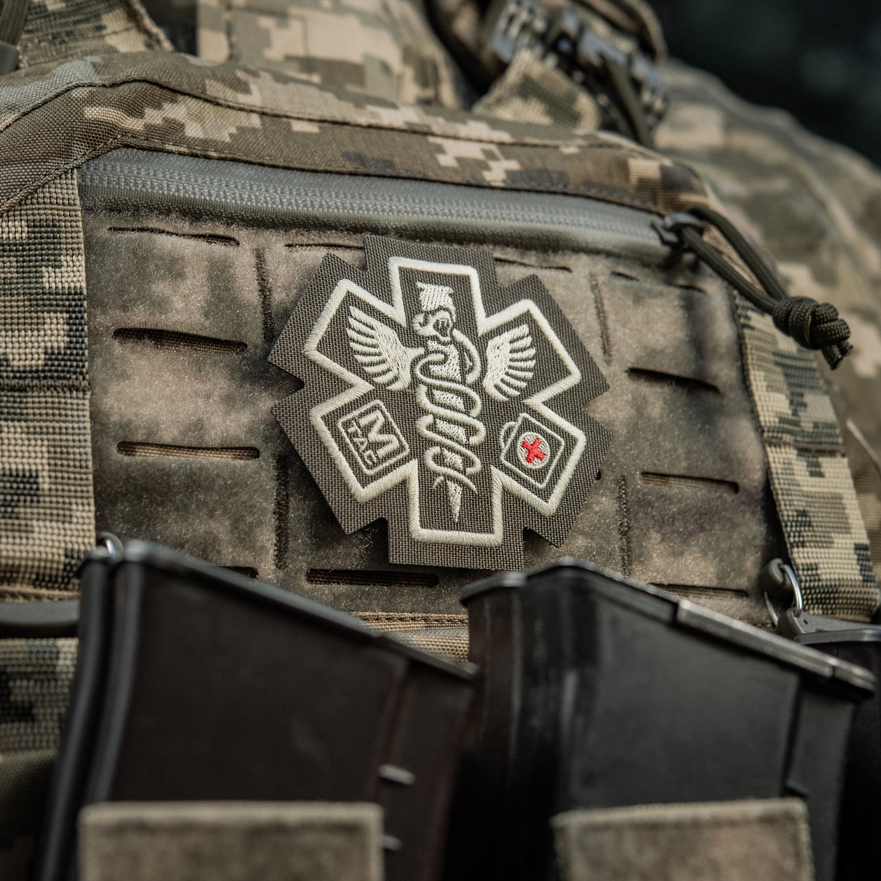 M-Tac Paramedic embroidered patch in ranger green, featuring detailed medical symbol and sturdy backing.