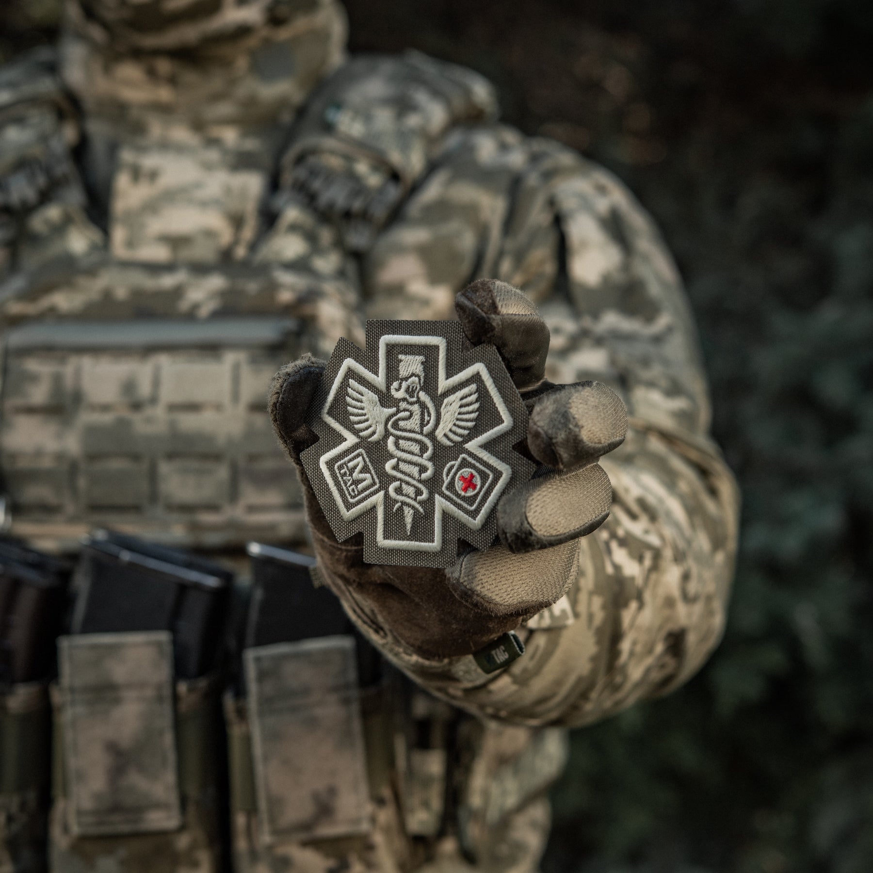 M-TAC Paramedic embroidered patch in ranger green, featuring detailed medical emblem design on a durable fabric background.