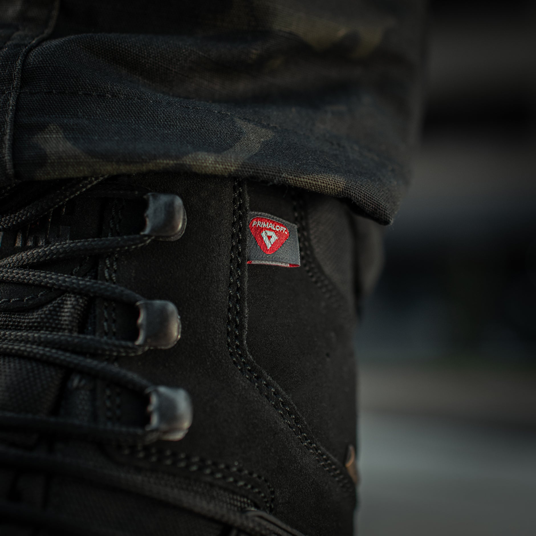 Black M-Tac tactical winter boots with rugged sole and waterproof design, suitable for cold weather outdoor activities.