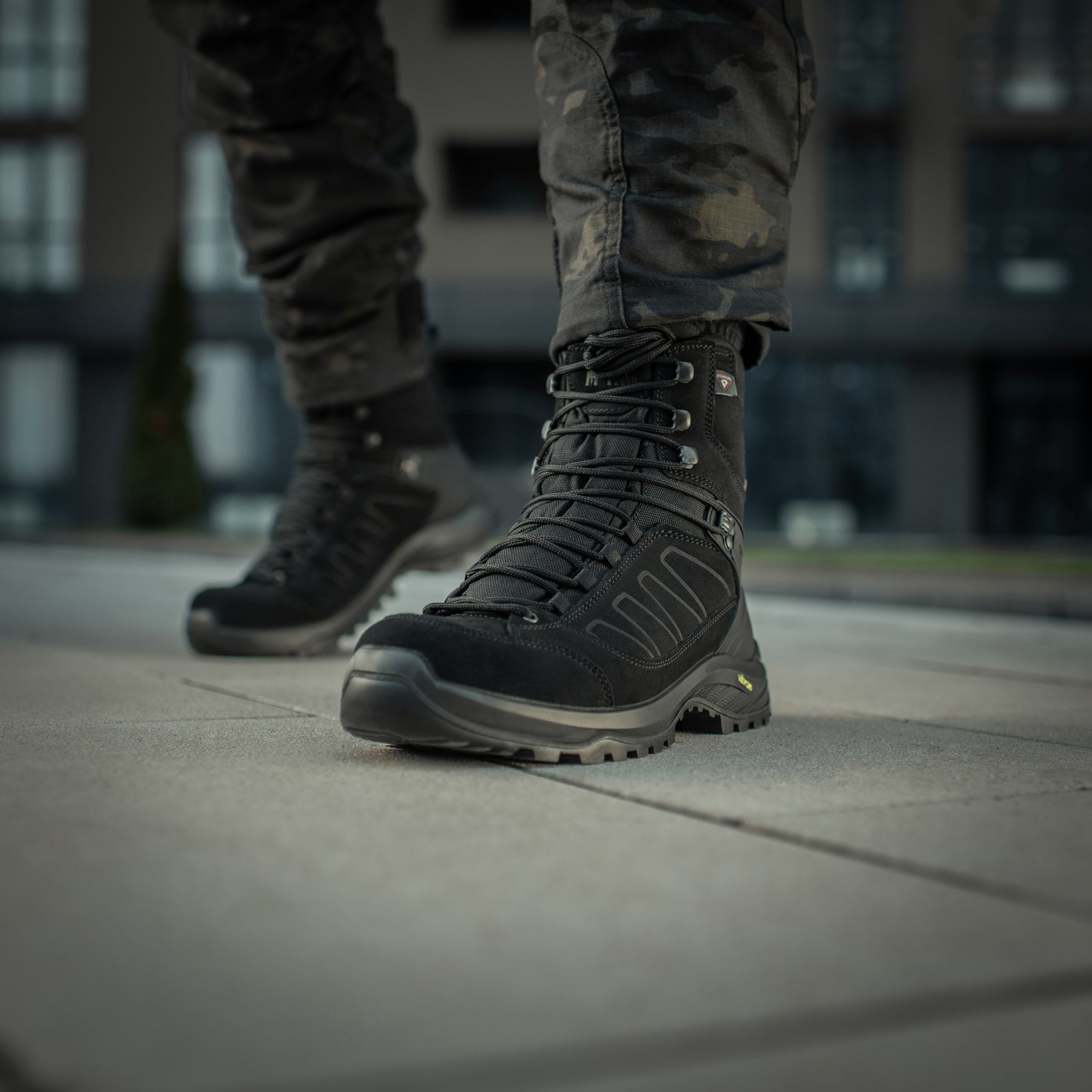 Black M-Tac tactical winter boots with rugged sole and durable design suitable for cold weather and outdoor tactical activities.