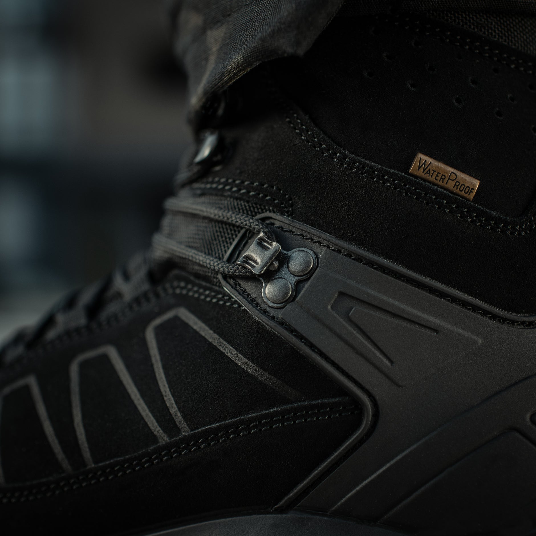 Black M-Tac tactical winter boots with rugged design and durable sole, suitable for cold weather and tactical use.