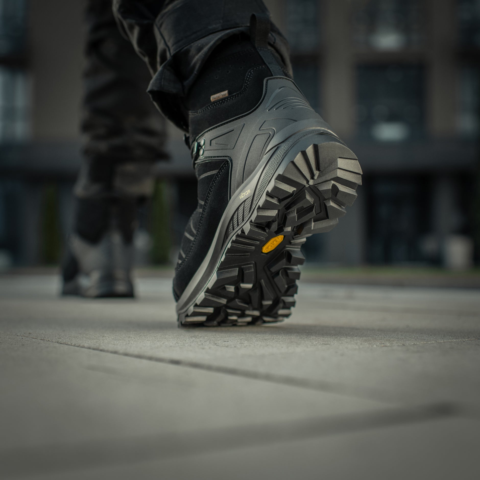 Black M-Tac tactical winter boots with rugged design and thick soles, suitable for cold weather and outdoor tactical use.