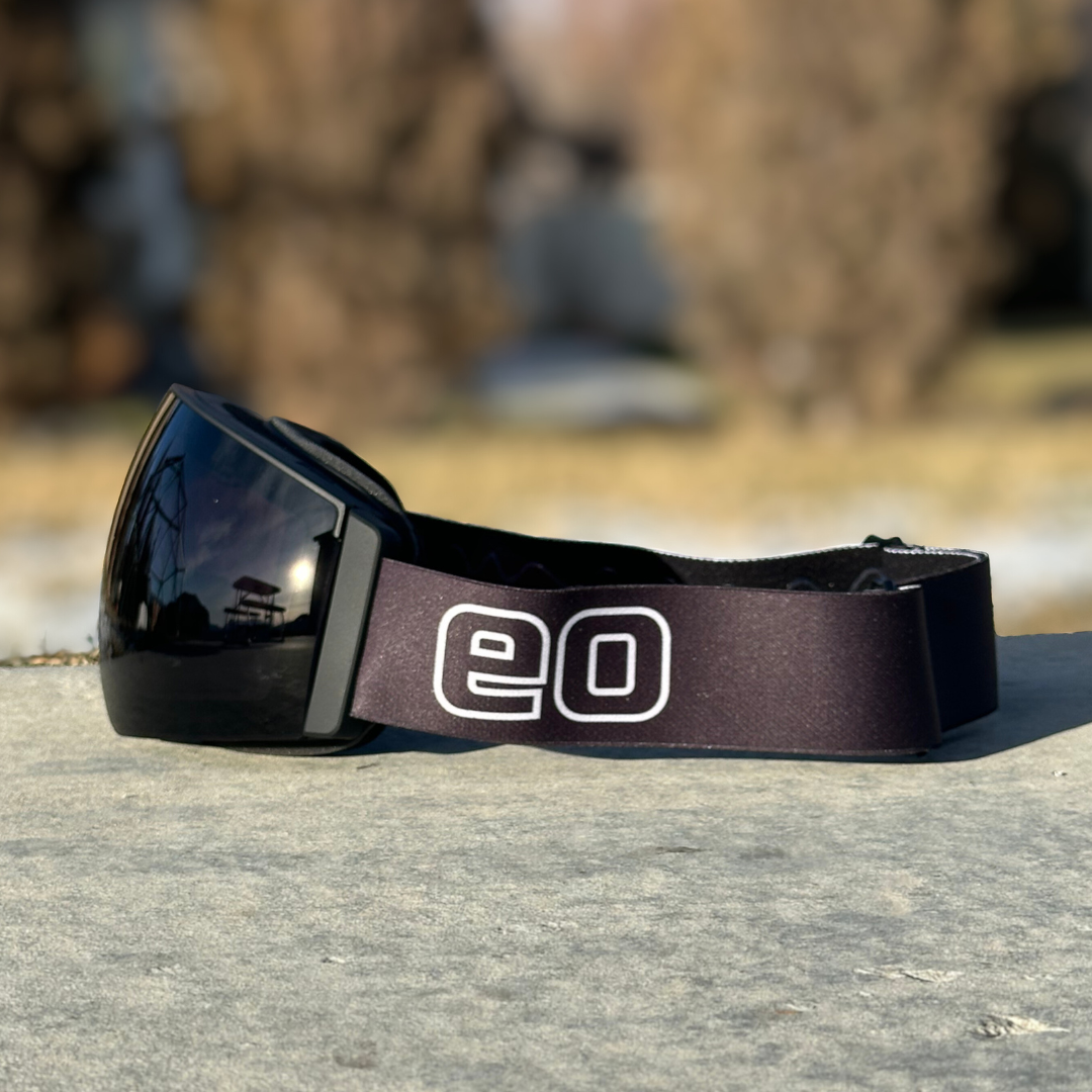 Eastern Outer MACH SCHNELL MAG photochromic ski and snowboard goggles in a sleek black profile view.
