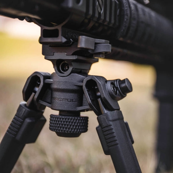 Magpul A.R.M.S.® 17S style bipod with pan and tilt for long-range shooting, in a tactical lifestyle setting.