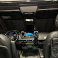 Canyon Adventure Vans CLIMA-SHADE™ insulated front windshield cover on vehicle windshield in outdoor setting.