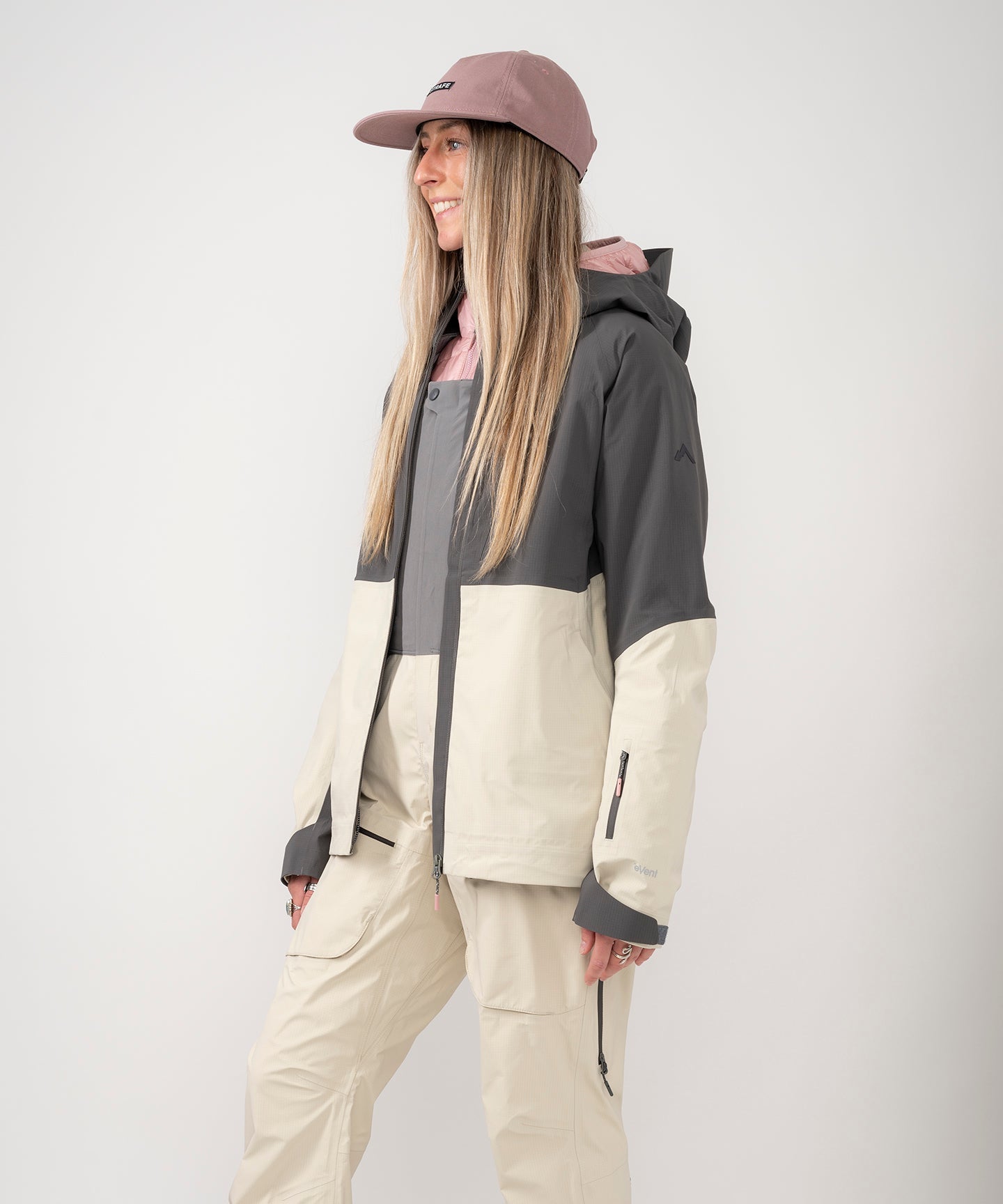 Strafe Outerwear Meadow 3L Shell Jacket in a scenic outdoor setting, showcasing its waterproof fabric and functional design.