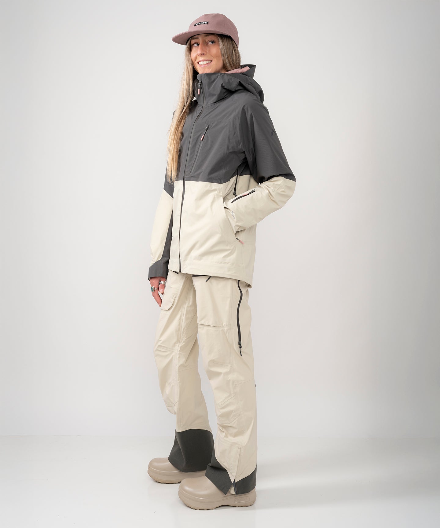 Strafe Outerwear Meadow 3L Shell Jacket in a vibrant color, showcasing its lightweight, waterproof design and hood.