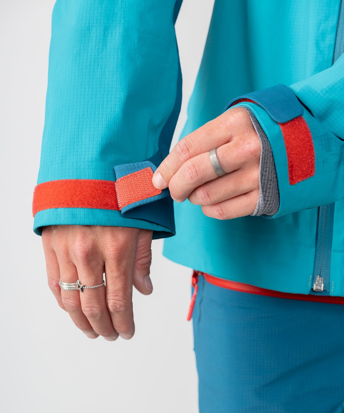 Strafe Outerwear Meadow 3L Shell Jacket in dark teal, showcasing a lightweight, waterproof design for outdoor activities.