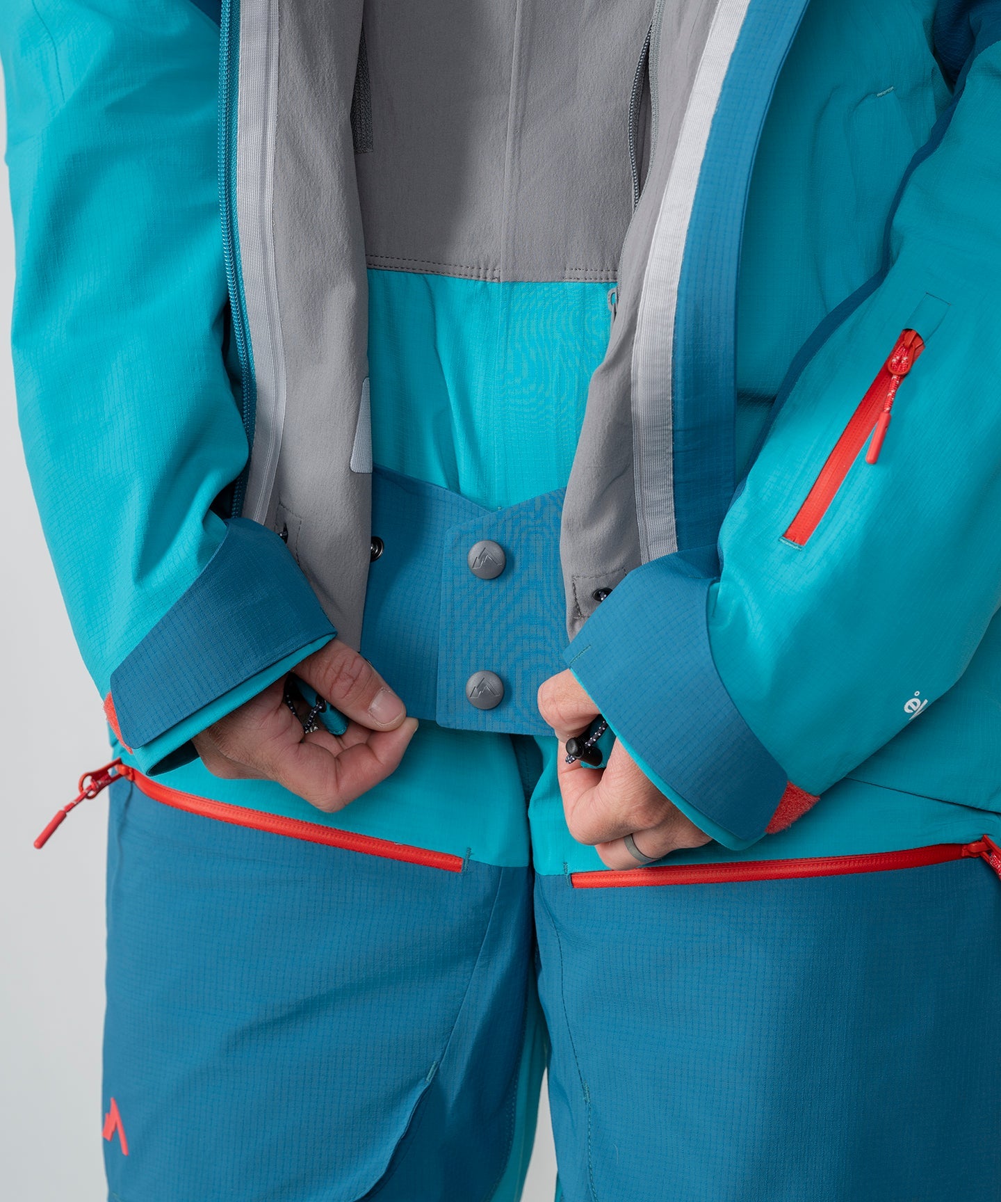 Strafe Outerwear Meadow 3L Shell Jacket in dark teal, showcasing waterproof fabric and adjustable features.
