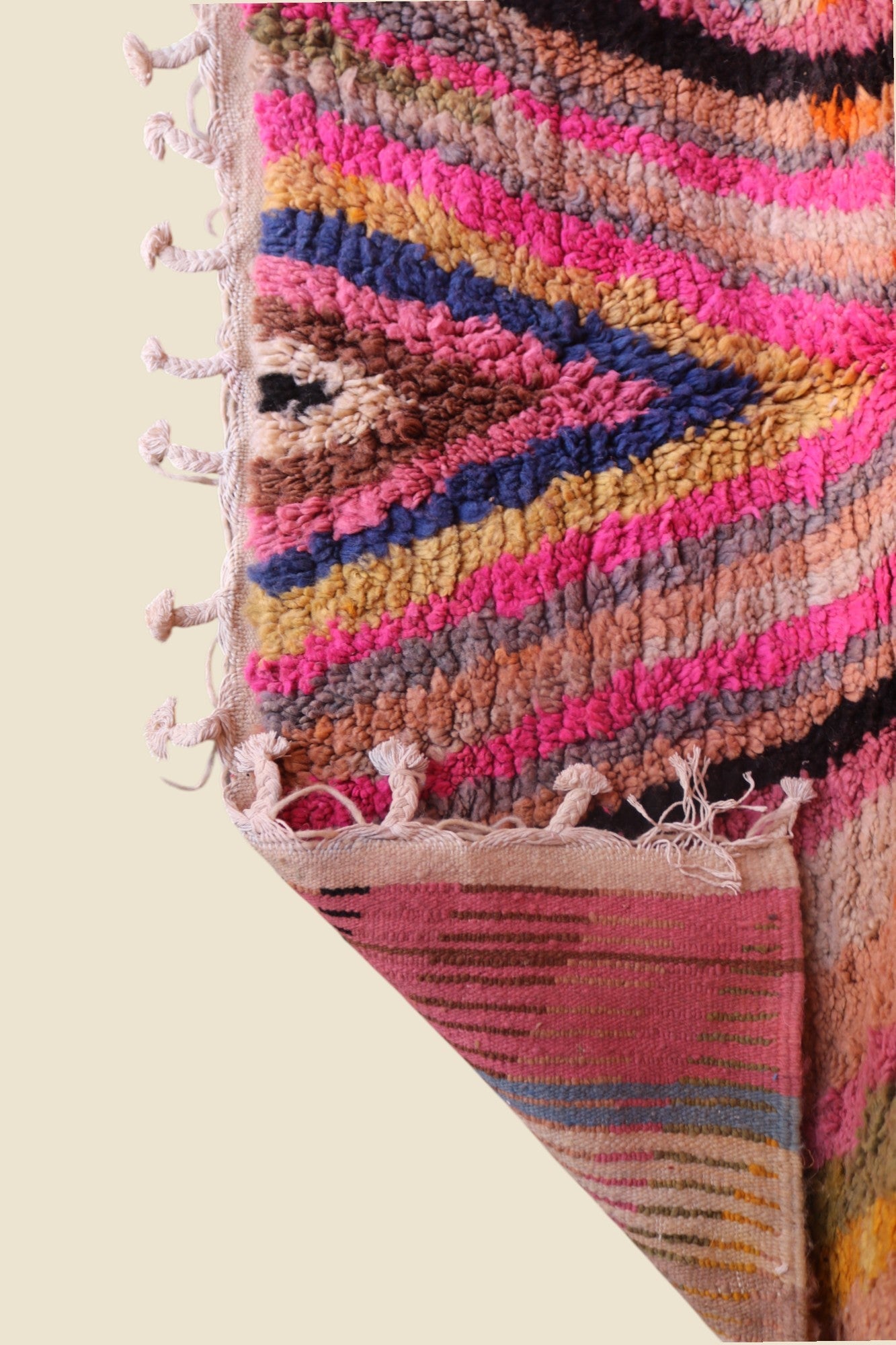 Handmade Anir Berber rug by LoomSouk, showcasing vibrant colors and intricate patterns typical of Moroccan wool rugs.