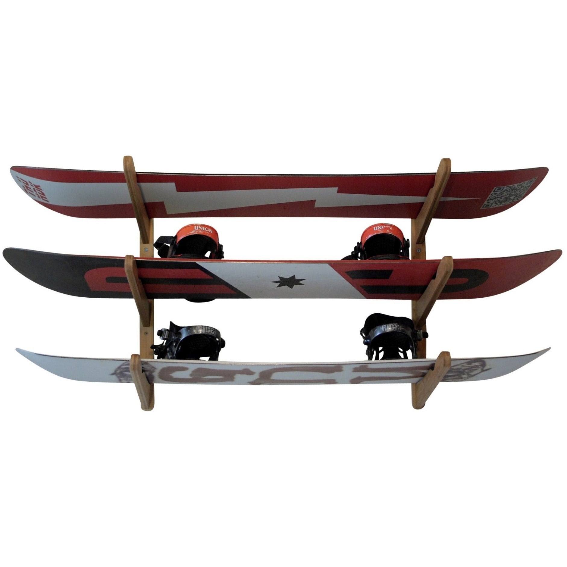 COR Surf triple bamboo wall rack holding surfboards, wakeboards, snowboards, and skateboards for organized storage.